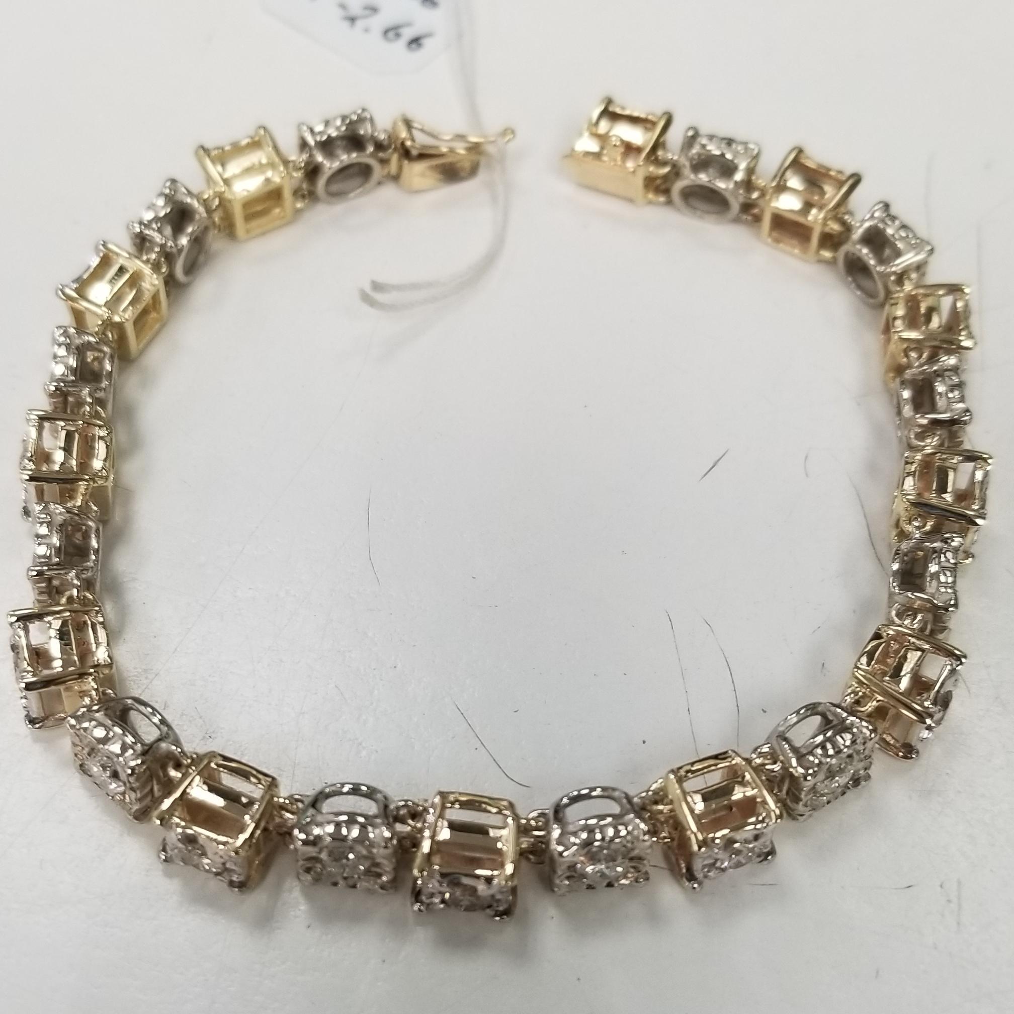 Vintage 14k yellow and white gold link bracelet, containing 24 round diamonds weighing 2.66cts.  Set in a 