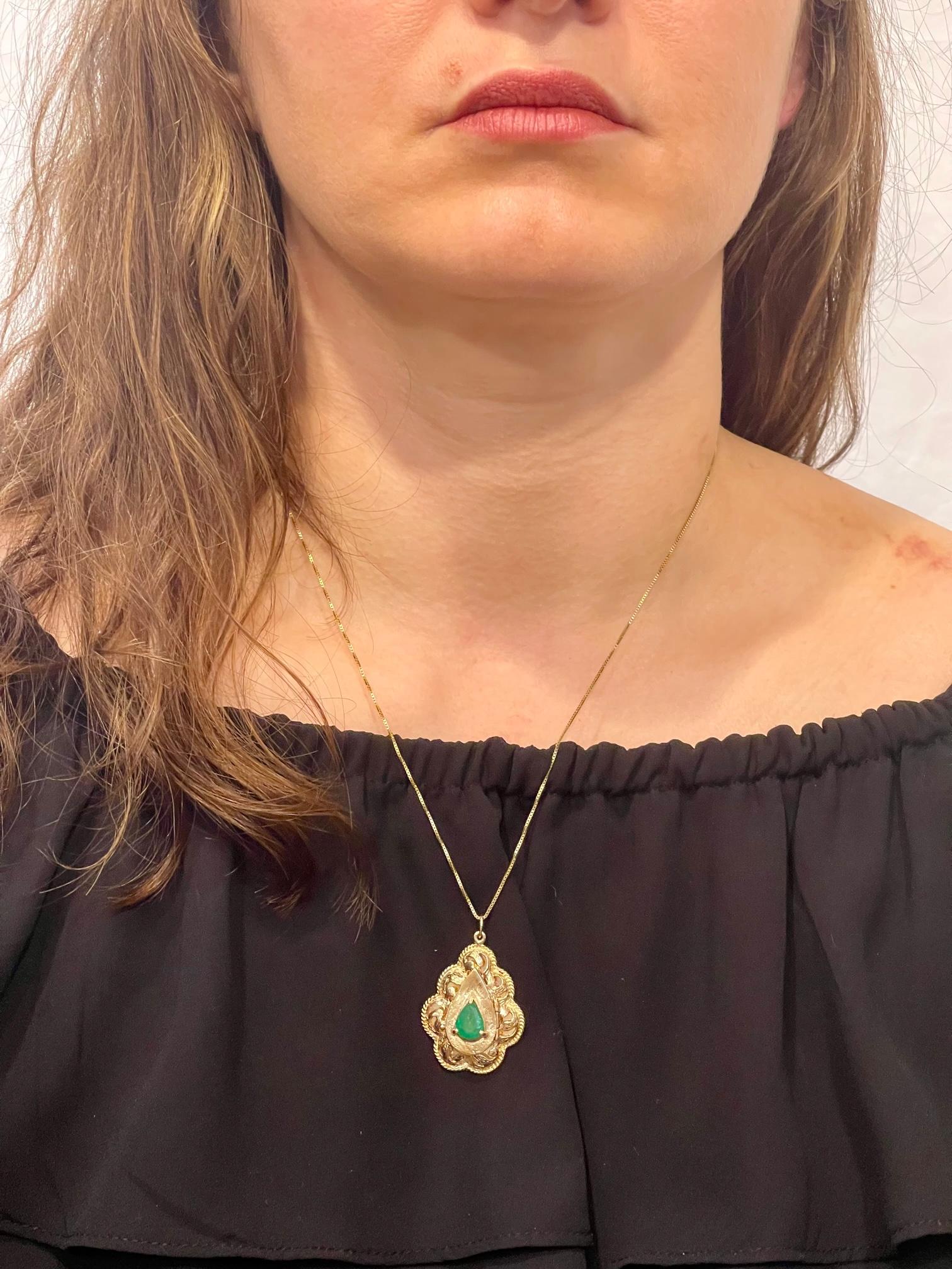Vintage 14 Karat Yellow Gold 10.5 Gm Chain with  Locket and Natural Emerald
 Locket is 1.5 inch long  and 1.1 Inch wide
22  Inches long with Pendant
Weight of the Necklace is 10.5  Grams 
Natural Brazilian Emerald , Pear shape , approximately 1.8