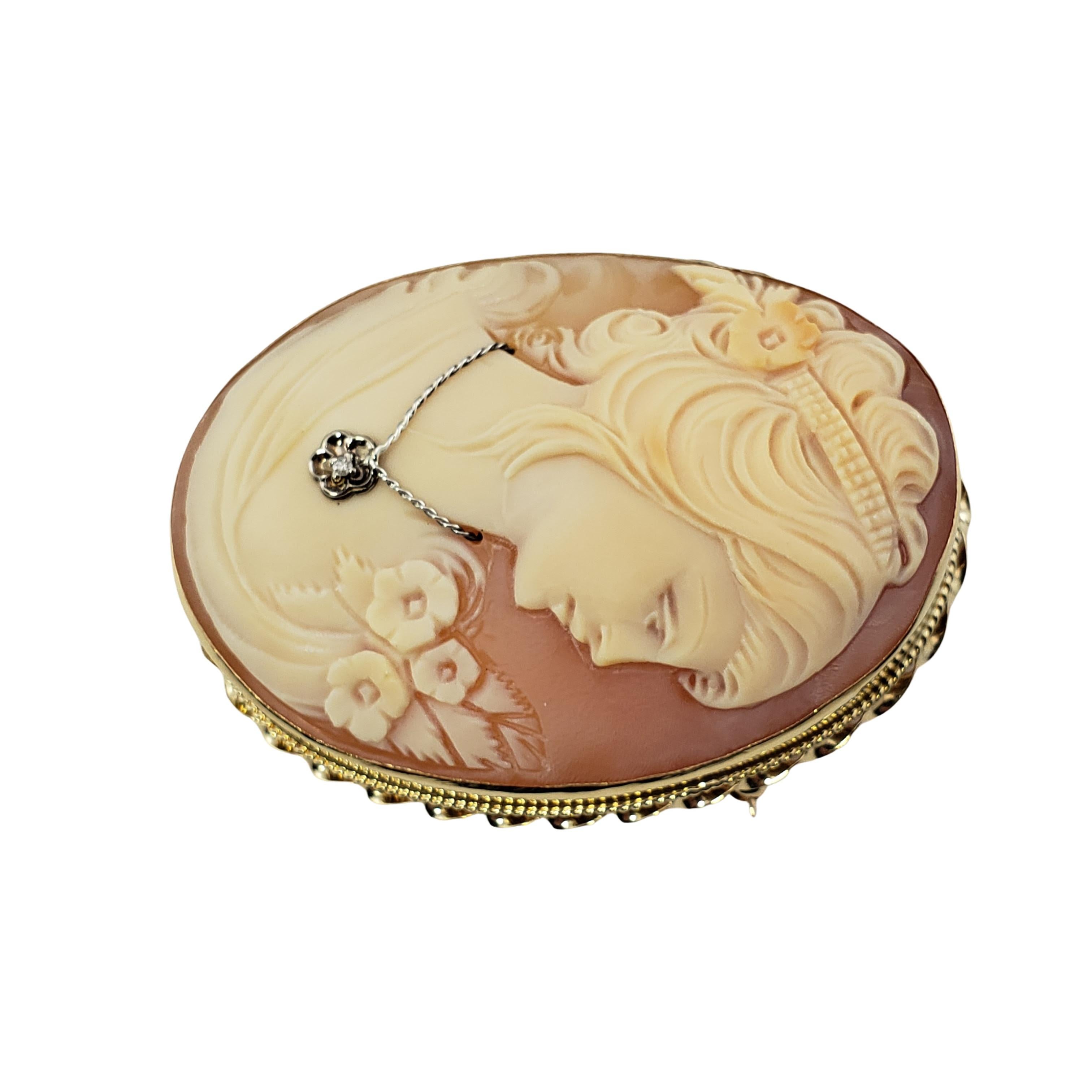 Vintage 14 Karat Yellow Gold and Diamond Cameo Brooch Pendant-

This elegant cameo features a lovely lady in profile set in beautifully detailed 14K yellow gold.  Accented with one round single cut diamond.  Can be worn as a brooch or a