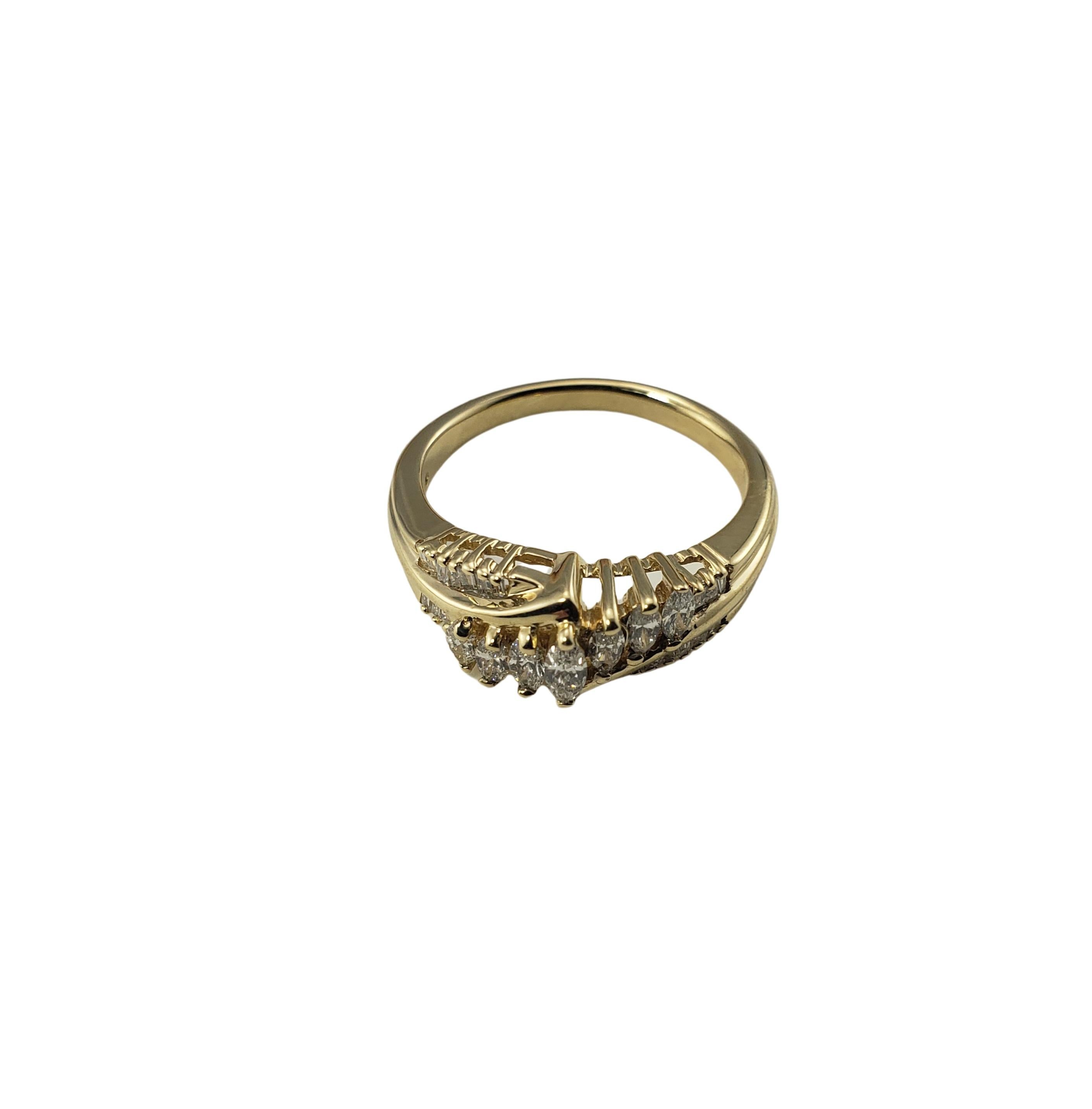 Vintage 14 Karat Yellow Gold and Diamond Ring Size 7.25-

This lovely ring features seven marquis diamonds and 19 baguette diamonds set in classic 14K yellow gold. Width: 6 mm.
Shank: 2 mm.

Approximate total diamond weight: .50 ct.

Diamond color: