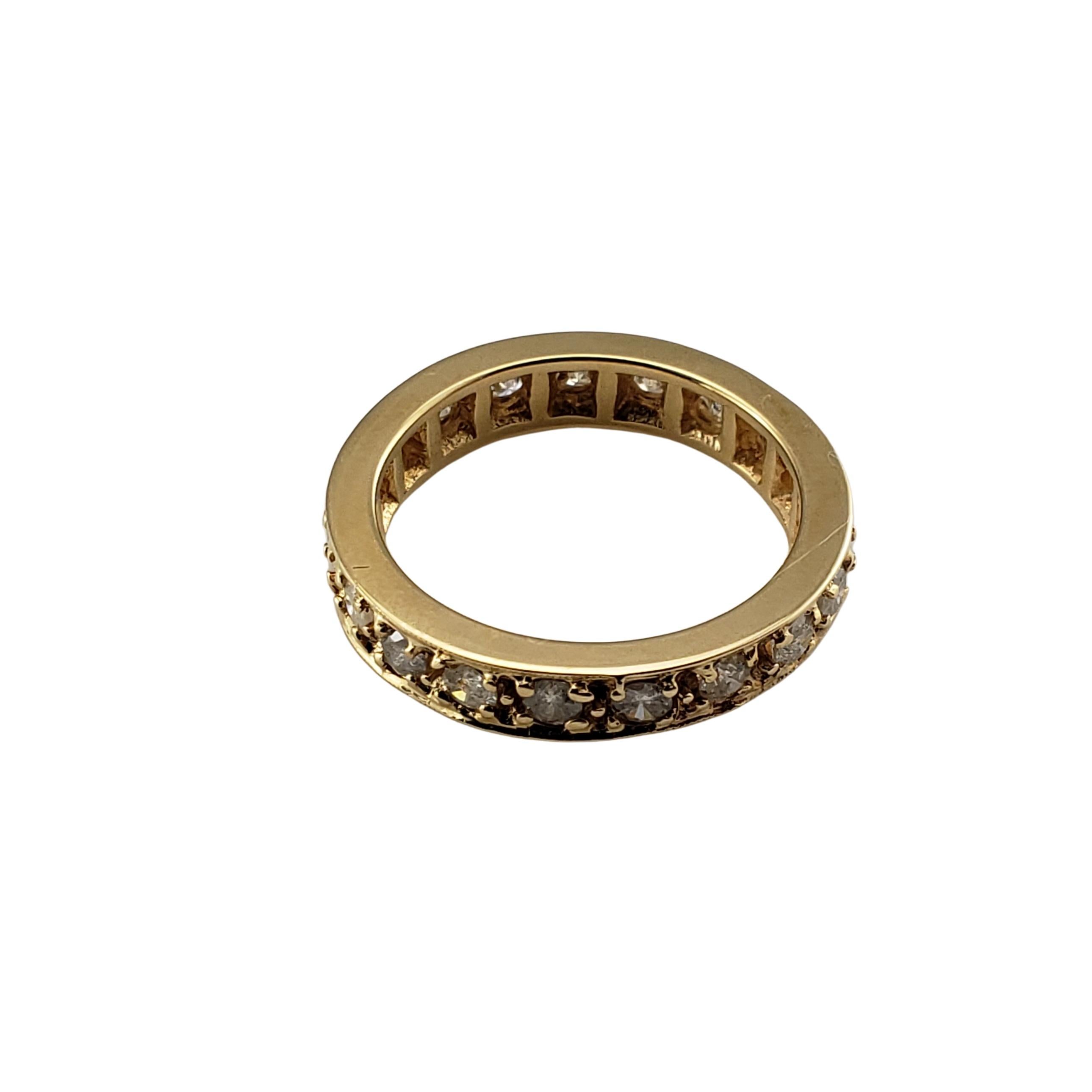 Vintage 14 Karat Yellow Gold and Diamond Wedding Band Ring Size 6-

This sparkling band features 19 round brilliant cut diamonds set in classic 14K yellow gold. Width: 4 mm.

Approximate total diamond weight: .95 ct.

Diamond color: I

Diamond