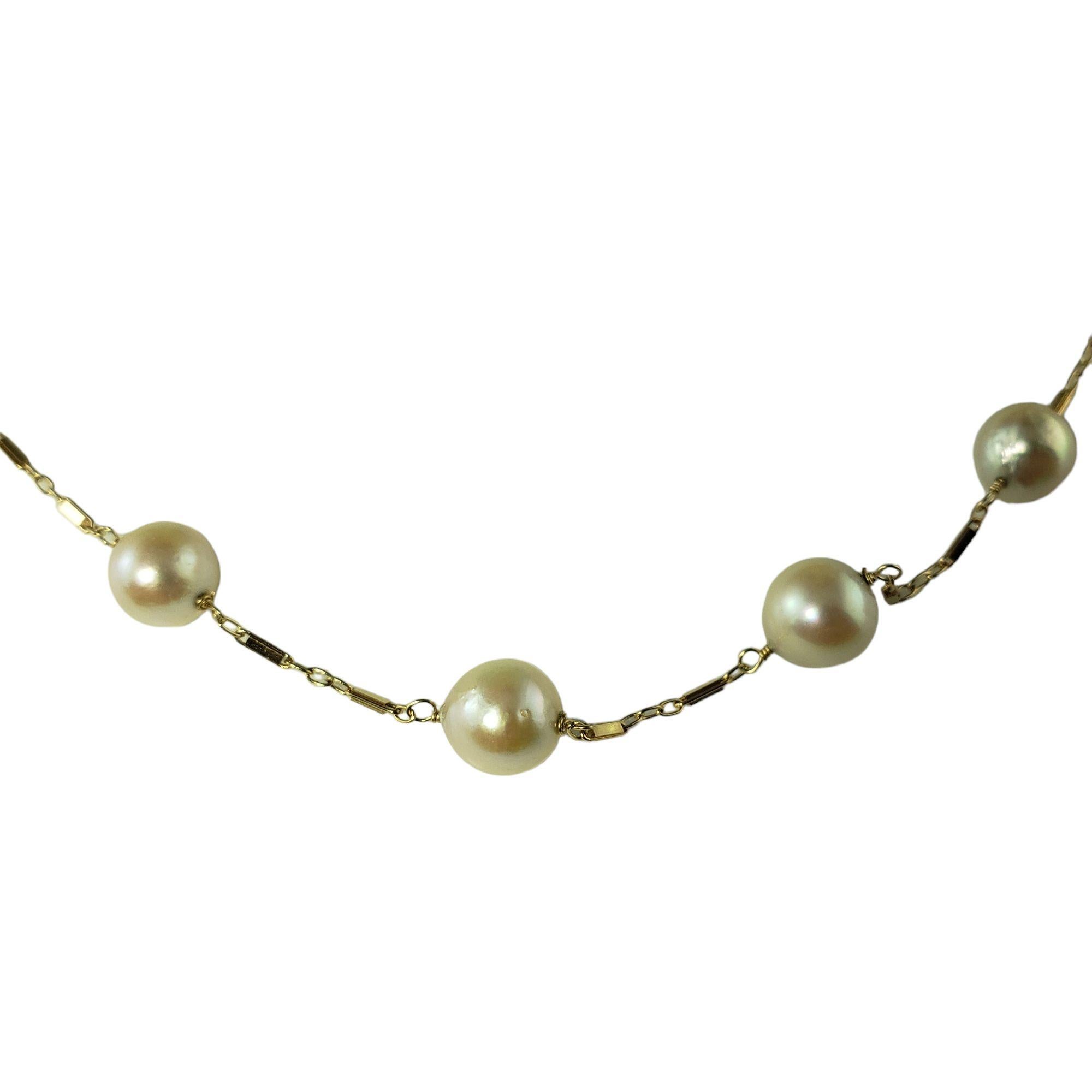 This lovely necklace feature 13 cultured freshwater pearls (8 mm each) set on a 14K yellow gold link chain.

Size:  17.5 inches

Weight:  12.0 gr./  7.7 dwt.

Stamped:  14K

Very good condition, professionally polished.

Will come packaged in a gift
