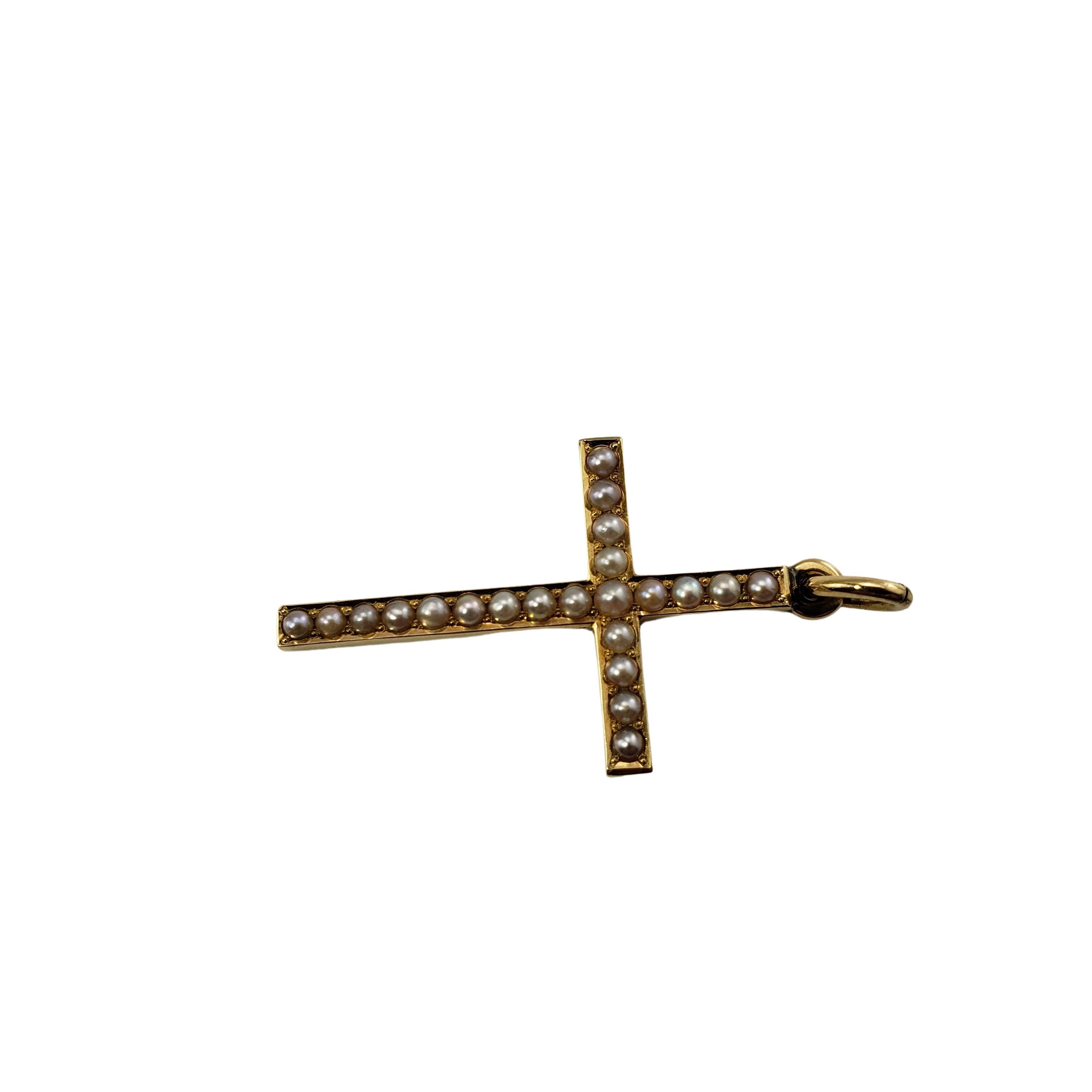 Vintage 14 Karat Yellow Gold and Pearl Cross Pendant-

This lovely cross pendant features 22 seed pearls set in beautifully detailed 14K yellow gold.

Size:  28 mm x 17 mm

Weight:  .9 dwt. /  1.4 gr.

Tested for 14K gold.

*Chain not included

Very