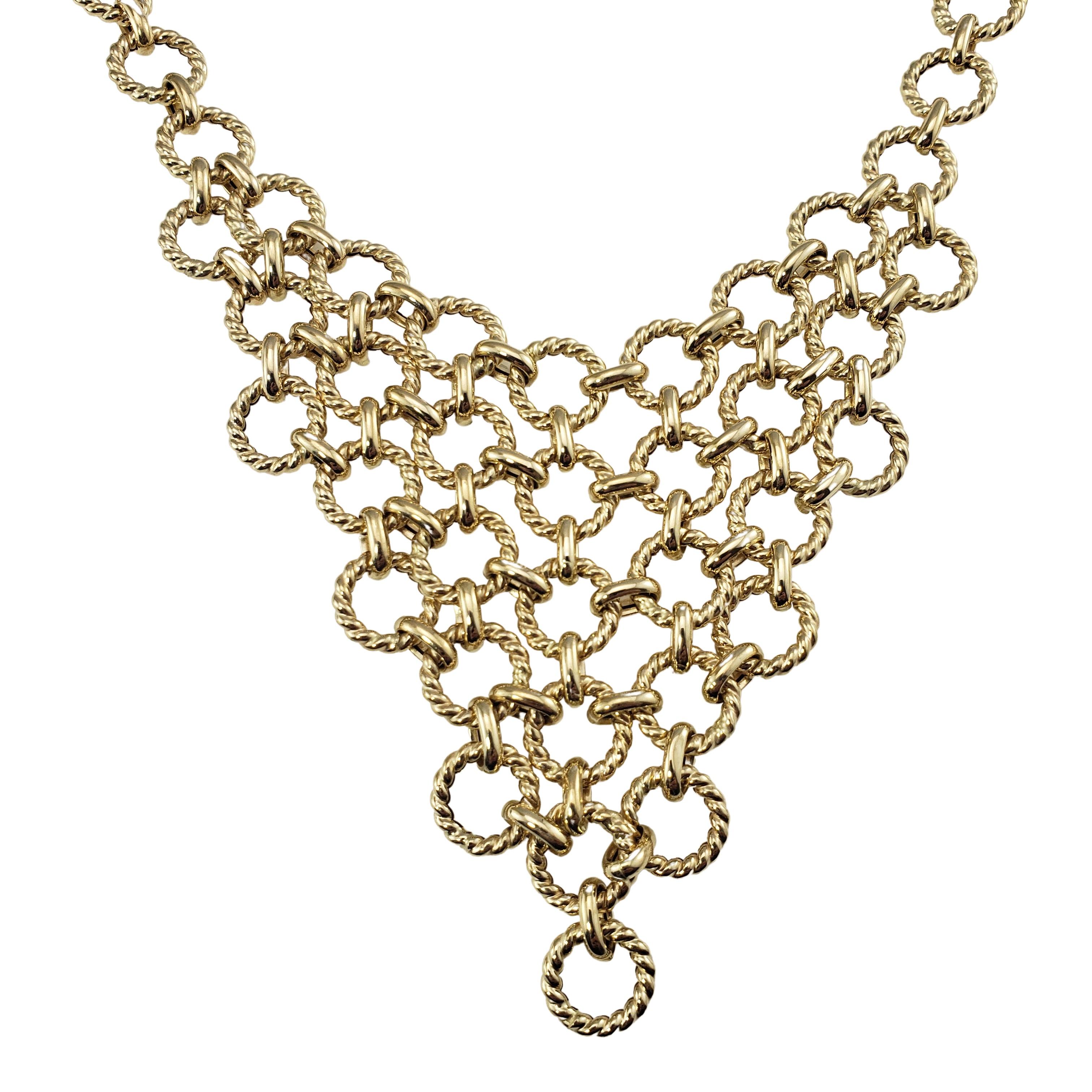 Vintage 14 Karat Yellow Gold Bib Necklace-

This elegant bib necklace is crafted in beautifully detailed 14K yellow gold.

Size: 18 inches  Drop: 3 inches

Weight:  11.2 dwt. /  17.4 gr.

Hallmark:  MILOR  14K  ITALY

Very good condition,