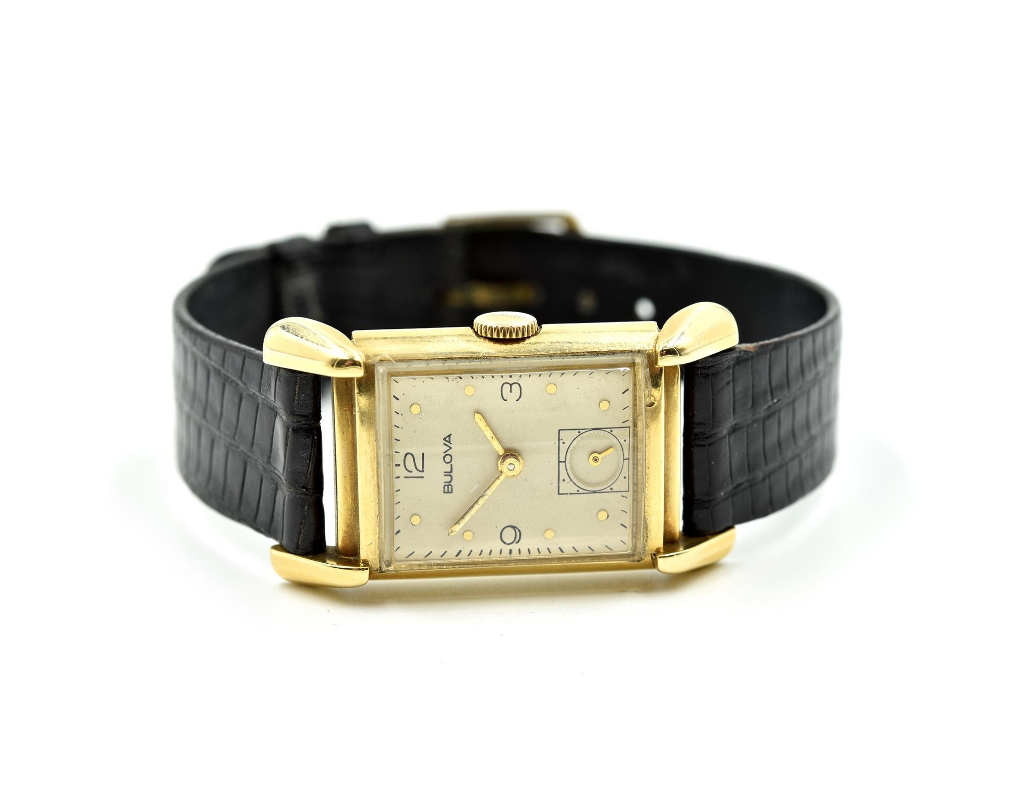 Movement: manual wind  
Function: hours, minutes, sub seconds
Case: 24x20mm 14k yellow gold case, acrylic crystal
Band: generic black leather strap, gold tone tang buckle
Dial: cream dial, gold hands, gold hour markers
Serial #: 6285XXX
