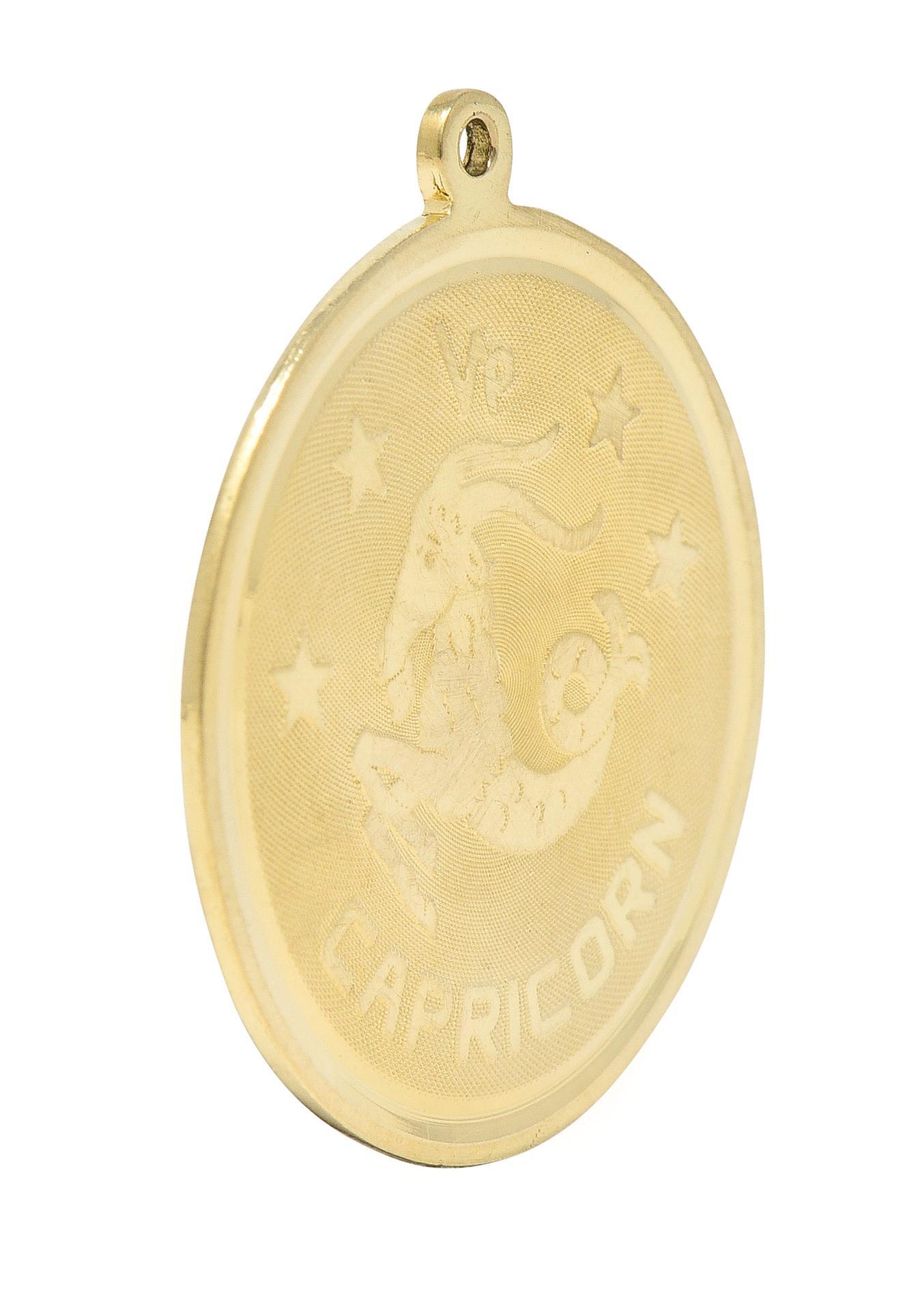 Designed as a round disk with high polished edges and a raised Capricorn zodiac motif
With the astrological Capricorn symbol, the Capricorn figure, stars, and inscribed 'CAPRICORN'
With a finely cross-hatch textured recess
Completed by pierced