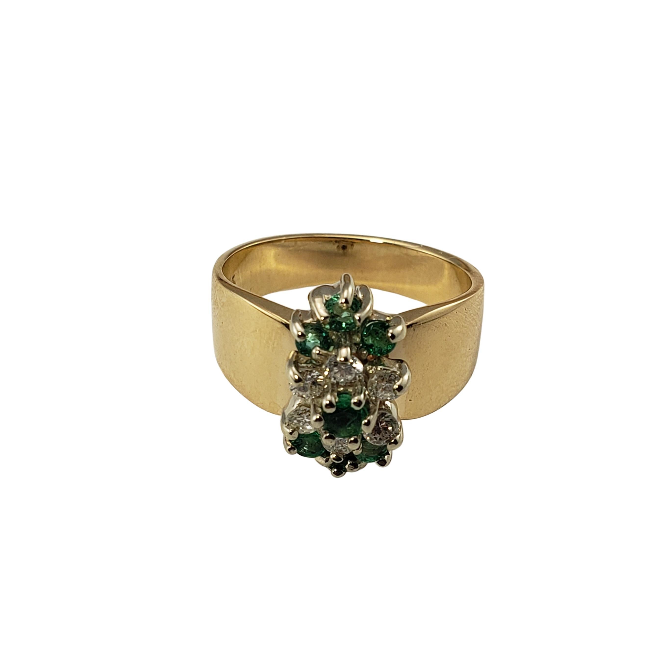 Vintage 14 Karat Yellow Gold Diamond and Natural Emerald Ring Size 6.25-

This lovely ring features six round brilliant cut diamonds and seven emeralds set in polished 14K yellow gold.  Width:  15 mm.
Shank:  4 mm.

Approximate total diamond weight: