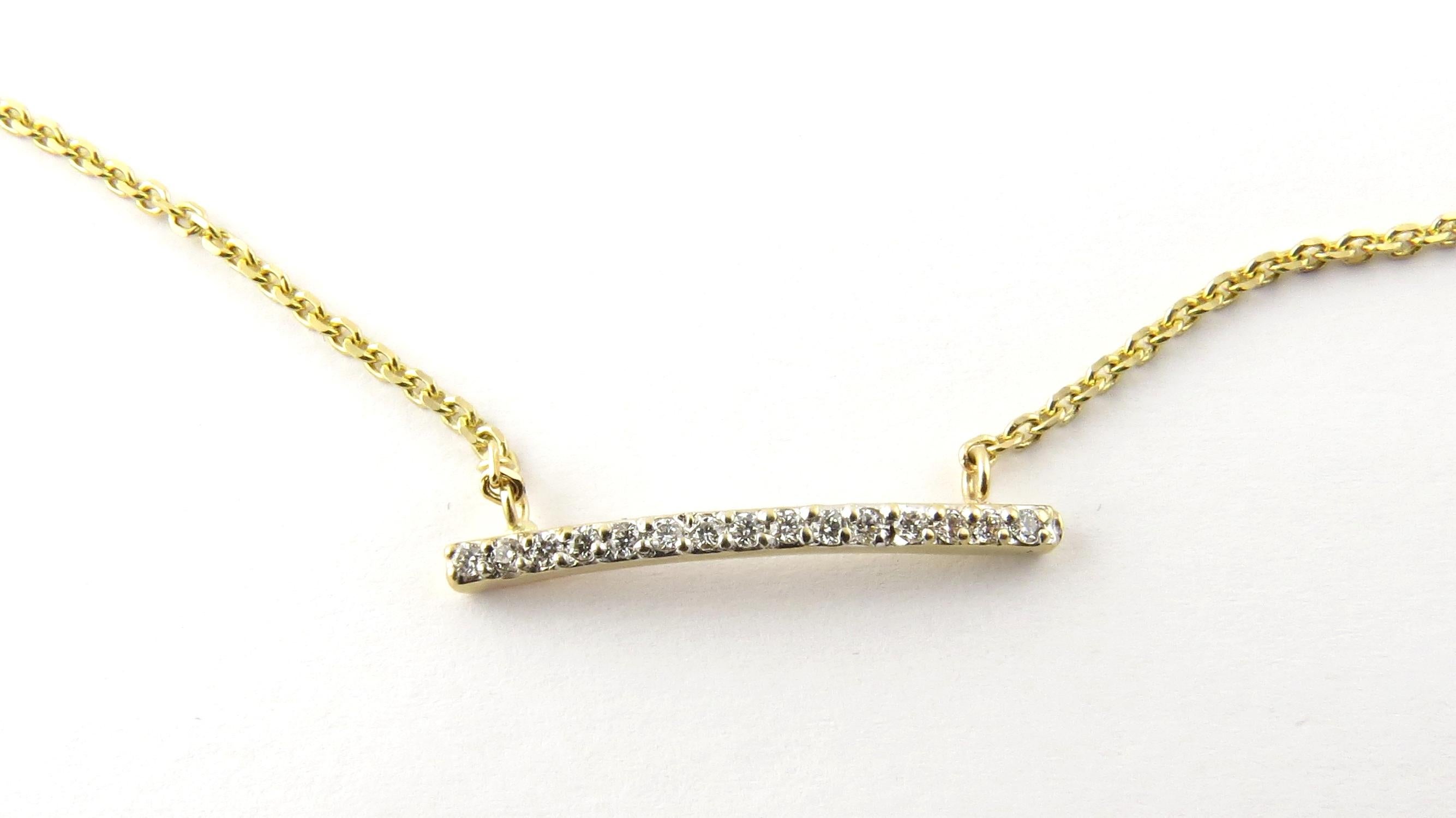 This sparkling necklace features a gracefully curved diamond bar (23 mm) adorned with round brilliant cut diamonds on a 16.5 inch yellow gold necklace.

Approximate total diamond weight:  .15 ct.

Diamond color:  G

Diamond clarity:  SI1-VS2

Size: 