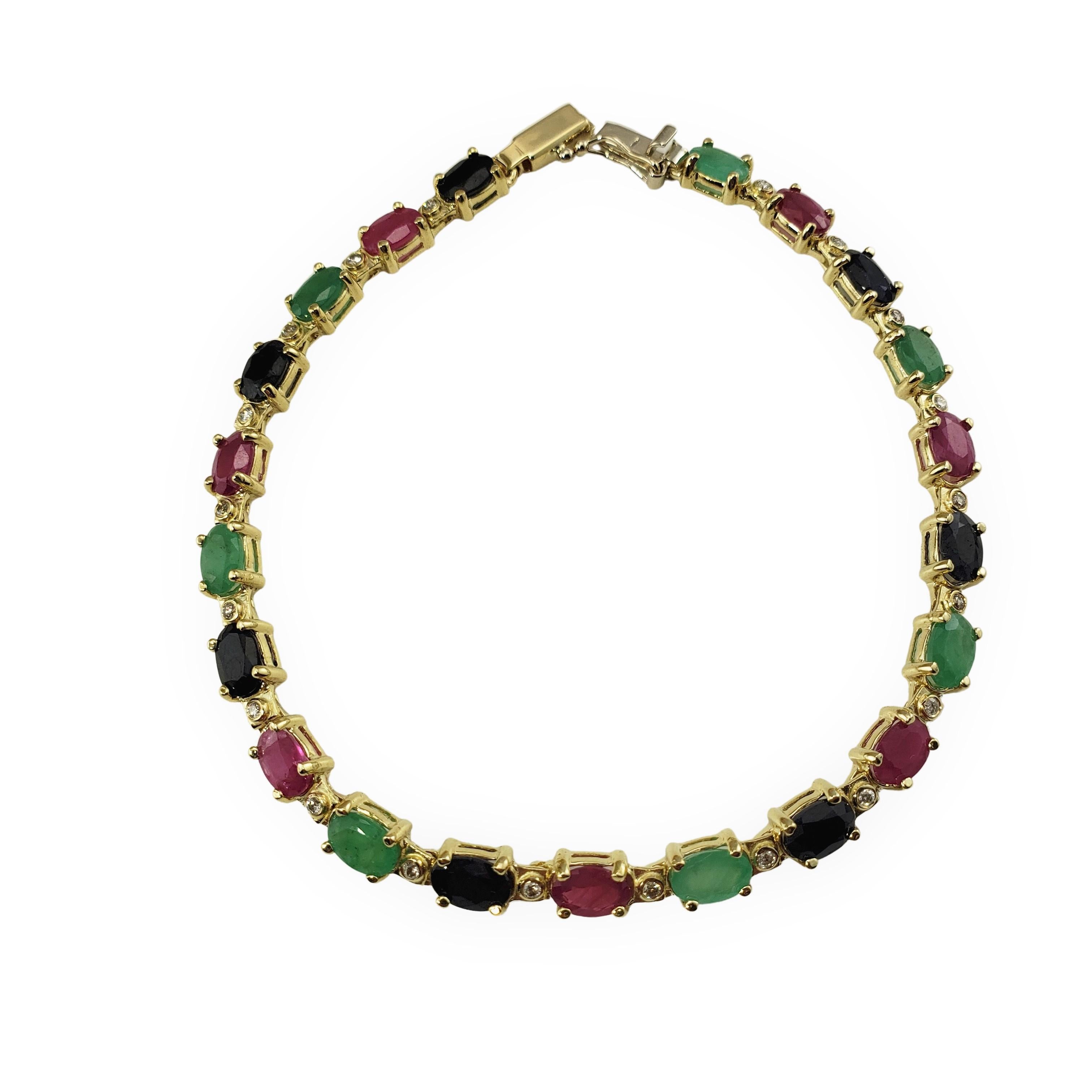 14 Karat Yellow Gold Diamond, Emerald, Sapphire and Ruby Bracelet-

This lovely bracelet features 20 round brilliant cut diamonds 21 oval ruby, sapphire and emerald gemstones (6 mm x 4 mm each) set in classic 14K yellow gold.   Width: 5