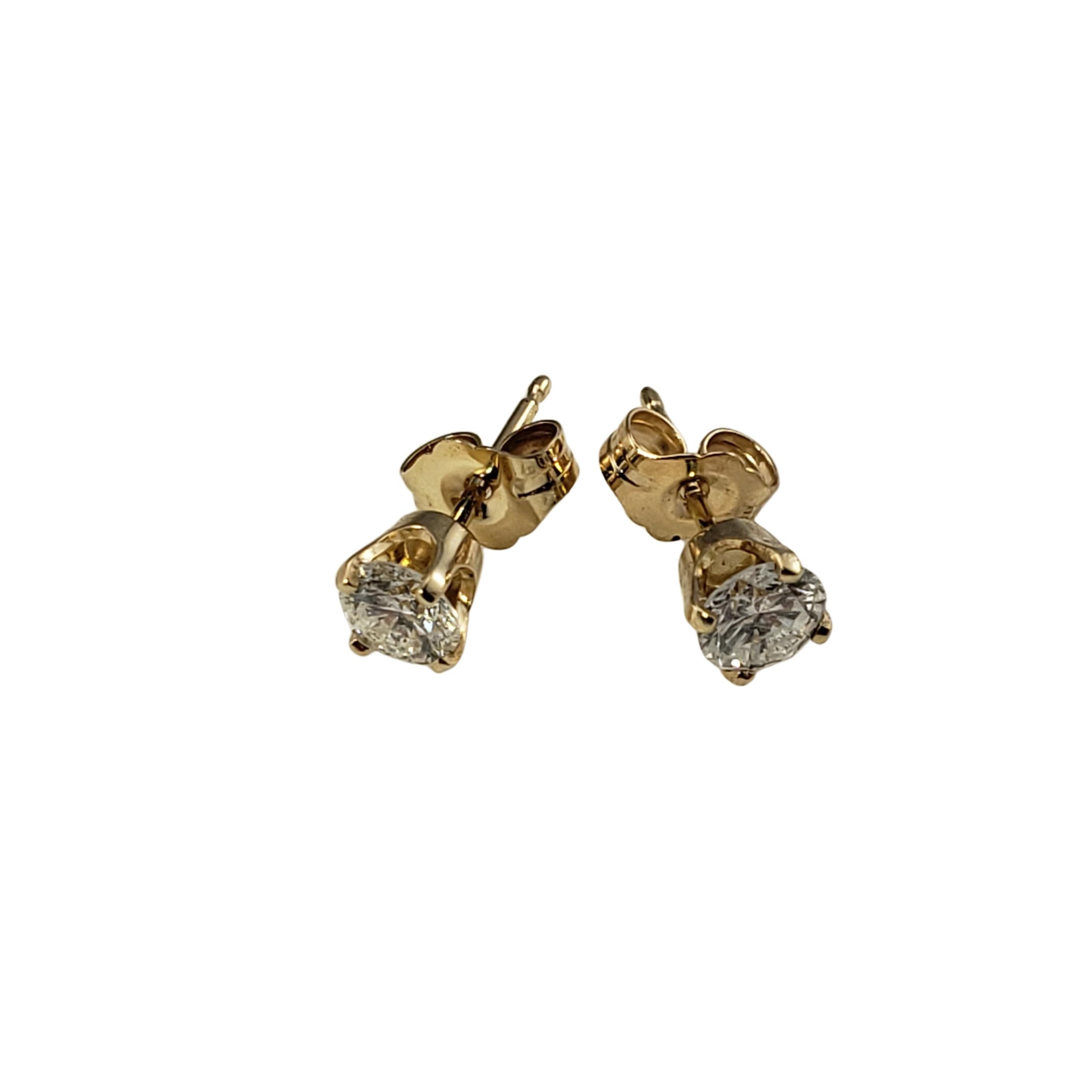 Vintage 14 Karat Yellow Gold Diamond Stud Earrings .60 TCW.-

These sparkling earrings each feature one round brilliant cut diamond set in classic 14K yellow gold.  Push back closures.

Approximate total diamond weight:  .60 ct.

Diamond color: