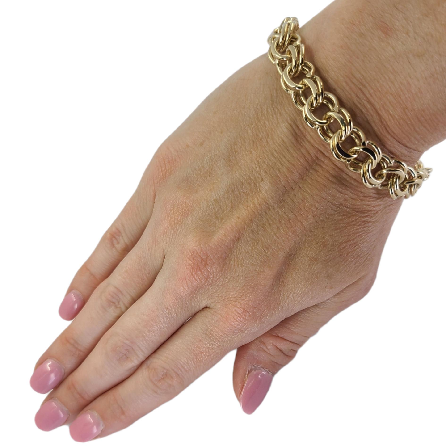 14 Karat Yellow Gold Double Link Charm Bracelet Measuring 7.5 Inches Long. Box Clasp With Figure 8 Safety. Finished Weight Is 37.0 Grams.