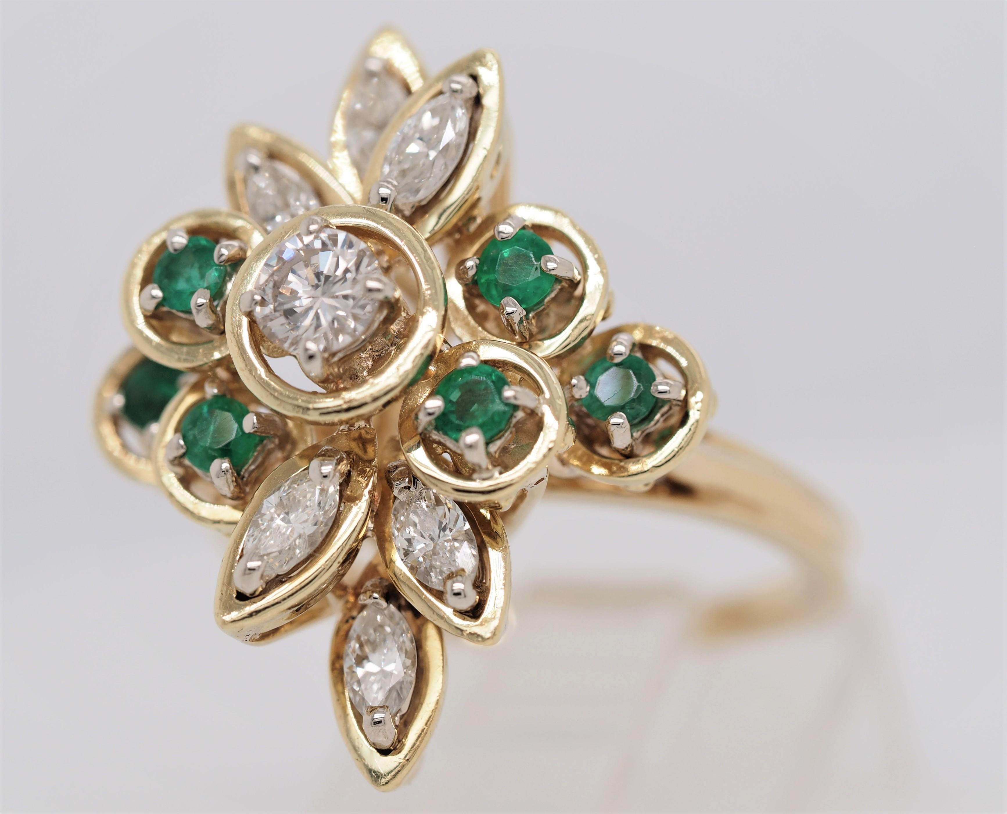 Classic 14K Yellow Gold Emerald and  Diamond Ring. This cocktail ring is crafted in 14 karat yellow gold featuring a round emerald weighing approximately 0.5 carats,  set in a 14 karat yellow gold four prong setting, flanked by 6 Marquise cut