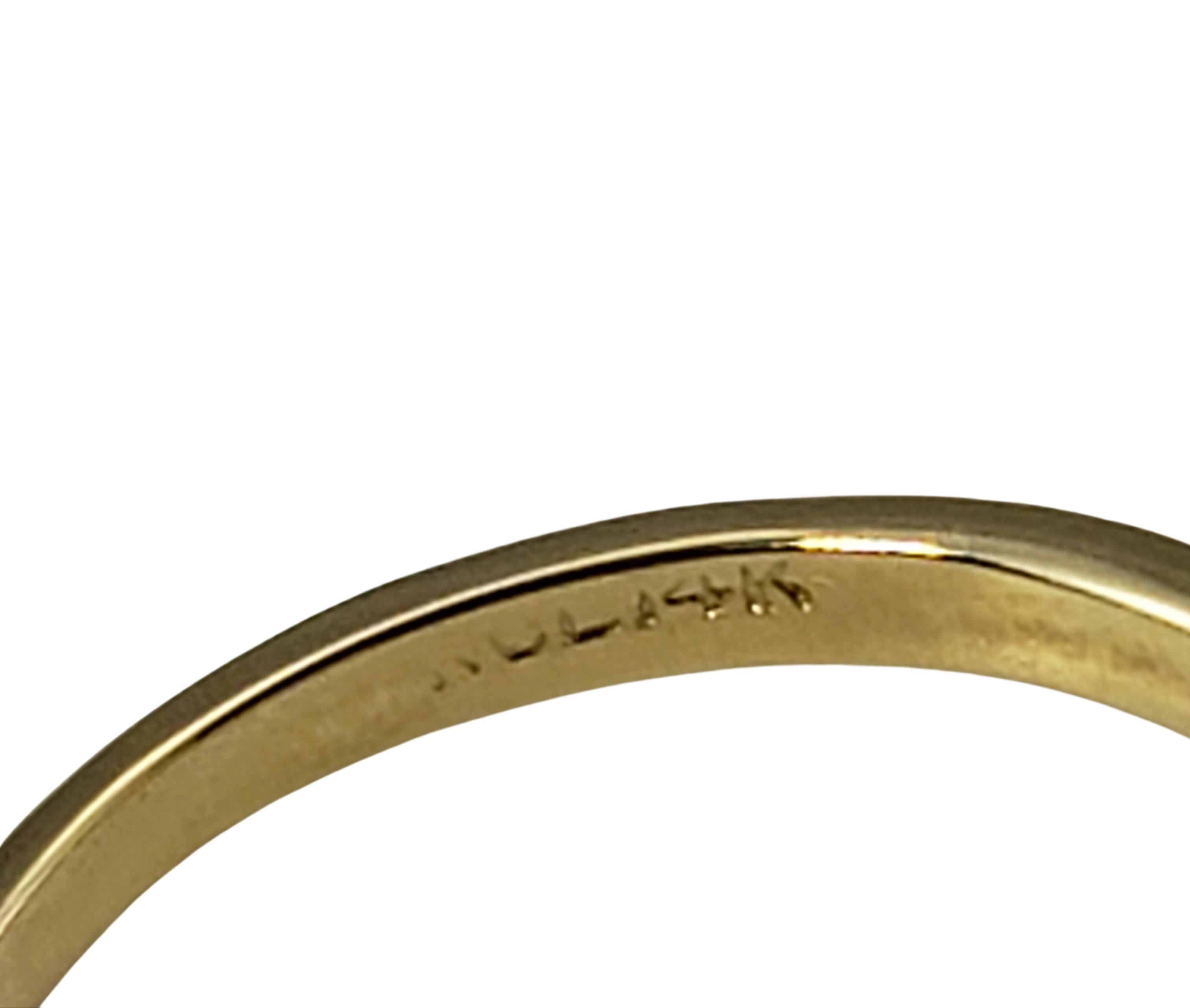 Anillo de oro amarillo de 14 quilates con esmeralda y diamantes 1