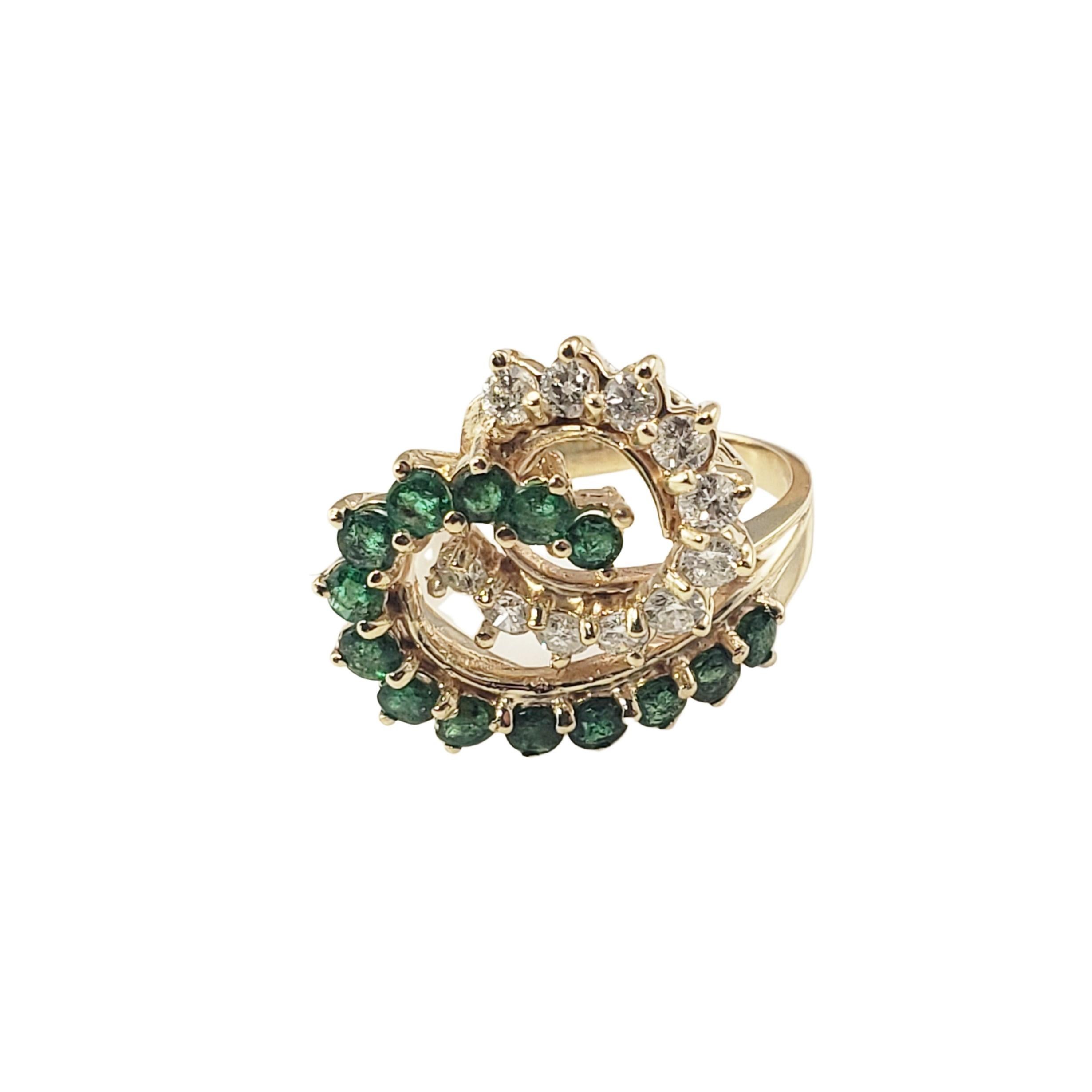 Vintage 14 Karat Yellow Gold Natural Emerald and Diamond Ring Size 6.25-

This stunning ring features 14 round natural emeralds and 11 round brilliant cut diamonds set in beautifully detailed 14K yellow gold.  
Width:  18 mm.  Shank:  2