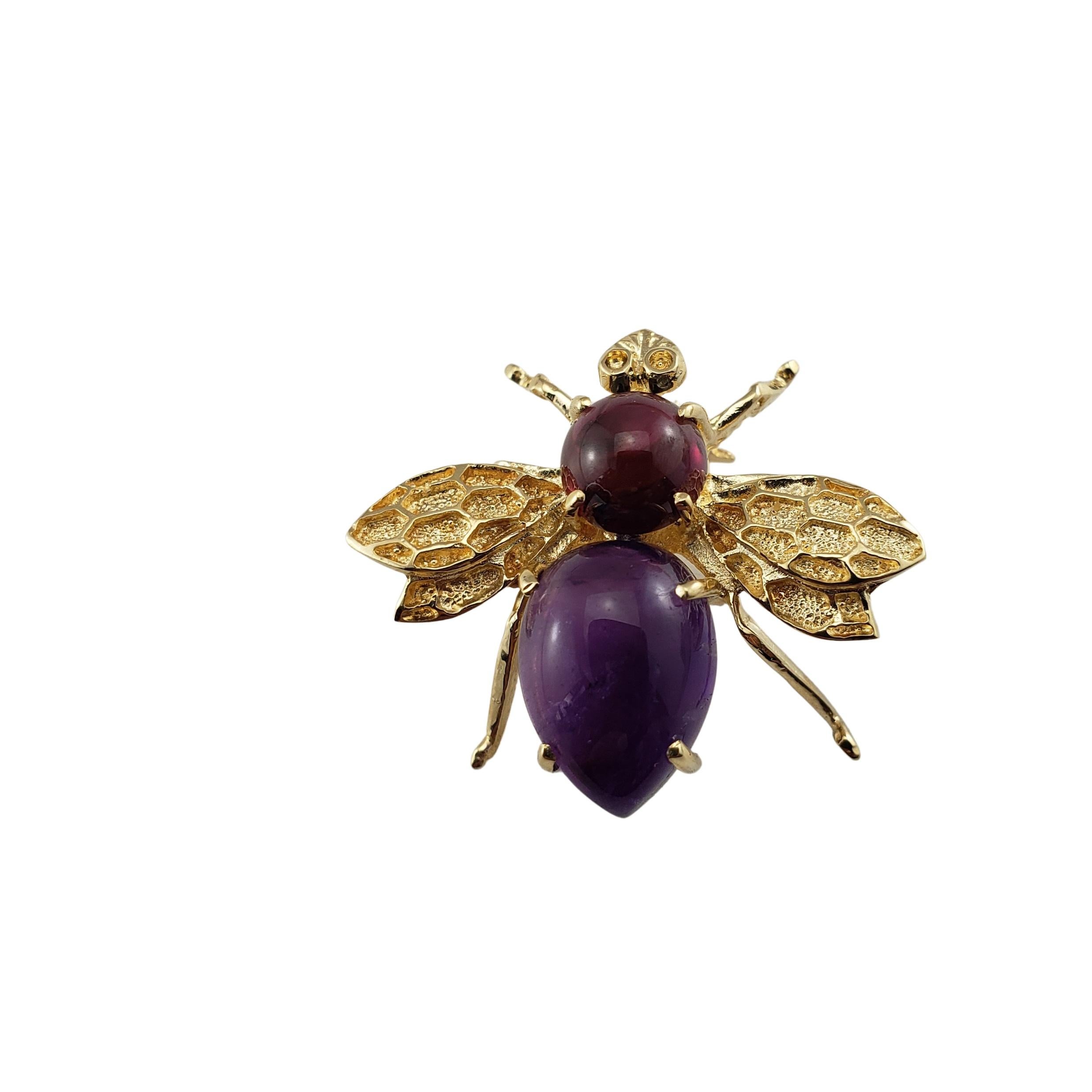 Vintage 14 Karat Yellow Gold Garnet and Amethyst Bee Pin/Brooch-

This lovely bee pin features one round cabochon garnet (6 mm) and one oval cabochon amethyst (12 mm x 8 mm) set in beautifully detailed 14K yellow gold.

Size:  20 mm x 24 mm

Weight:
