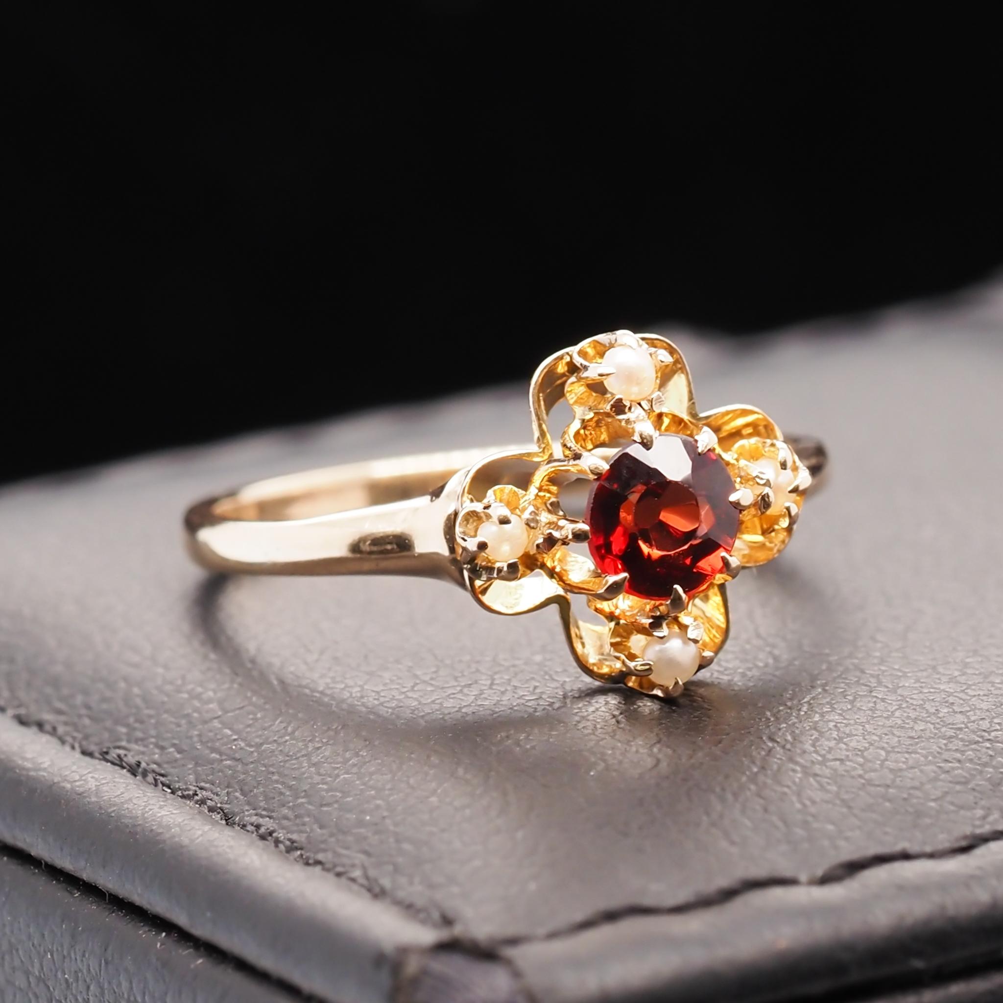 Year: 1940s

Item Details:
Ring Size: 6.5
Metal Type: 14k Yellow Gold  [Hallmarked, and Tested]
Weight: 1.9  grams

Garnet Details: 4.65mm, deep red, natural , old European cut

Band Width: 1.55mm
Condition:  Excellent