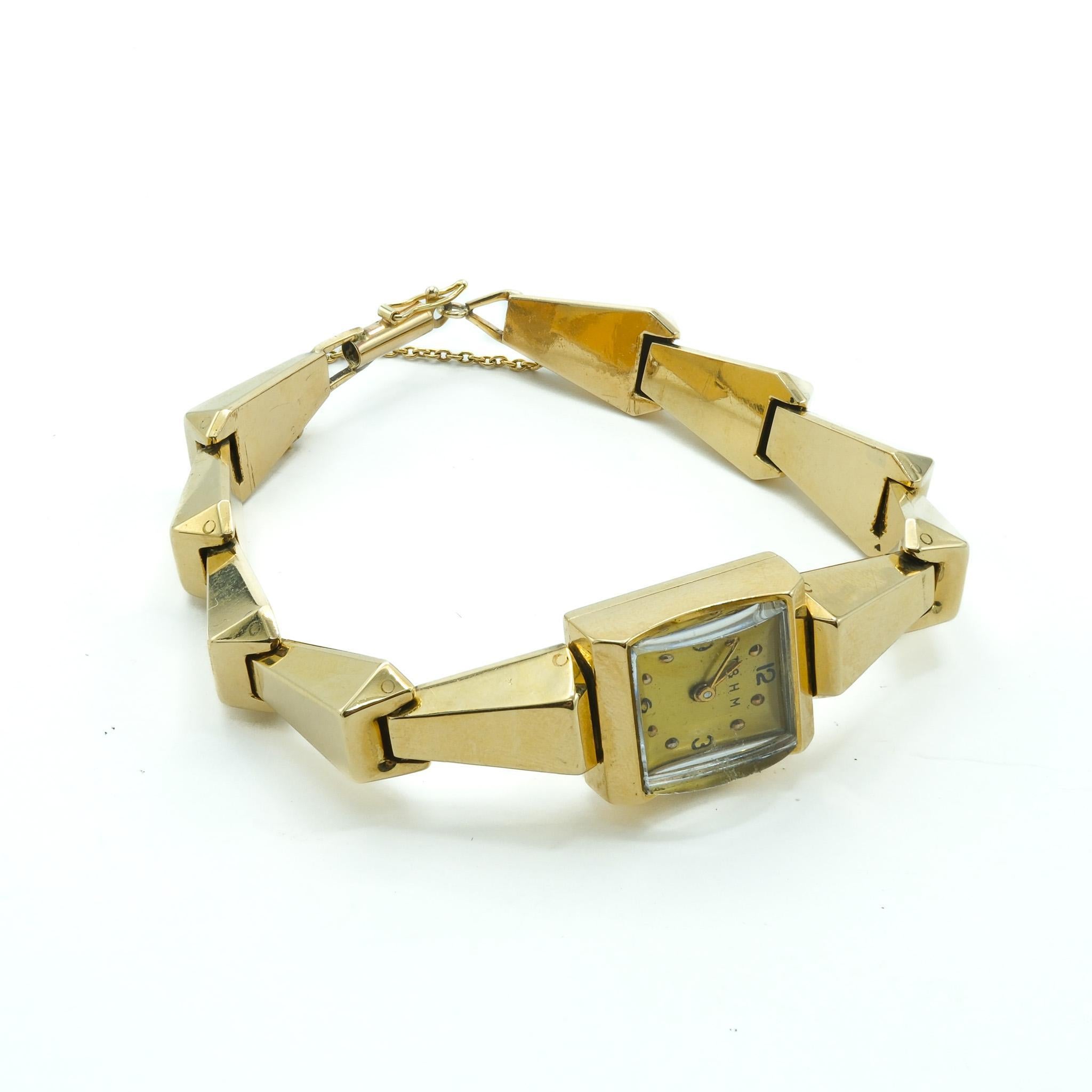 Présentant un splendide exemple de savoir-faire du milieu du XXe siècle, cette montre pour dame en or jaune 14 carats d'AT&T est un emblème d'élégance et de précision. Fabriquée dans les années 1950, elle est dotée d'un mouvement exclusif Blancpain,