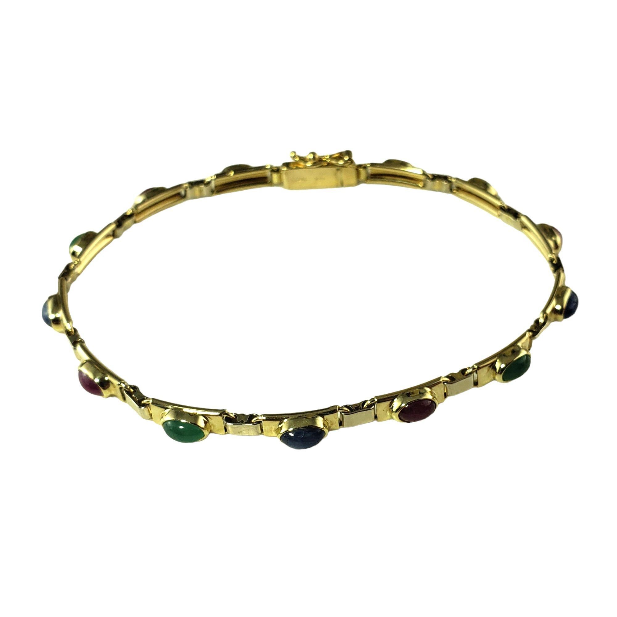 Vintage 14 Karat Gelbgold Natürliche Cabochon Rubin, Saphir und Smaragd-Armband-

Dieses elegante Armband besteht aus fünf natürlichen Saphiren mit Cabochon, vier natürlichen Rubinen mit Cabochon und vier natürlichen Smaragden mit Cabochon, gefasst