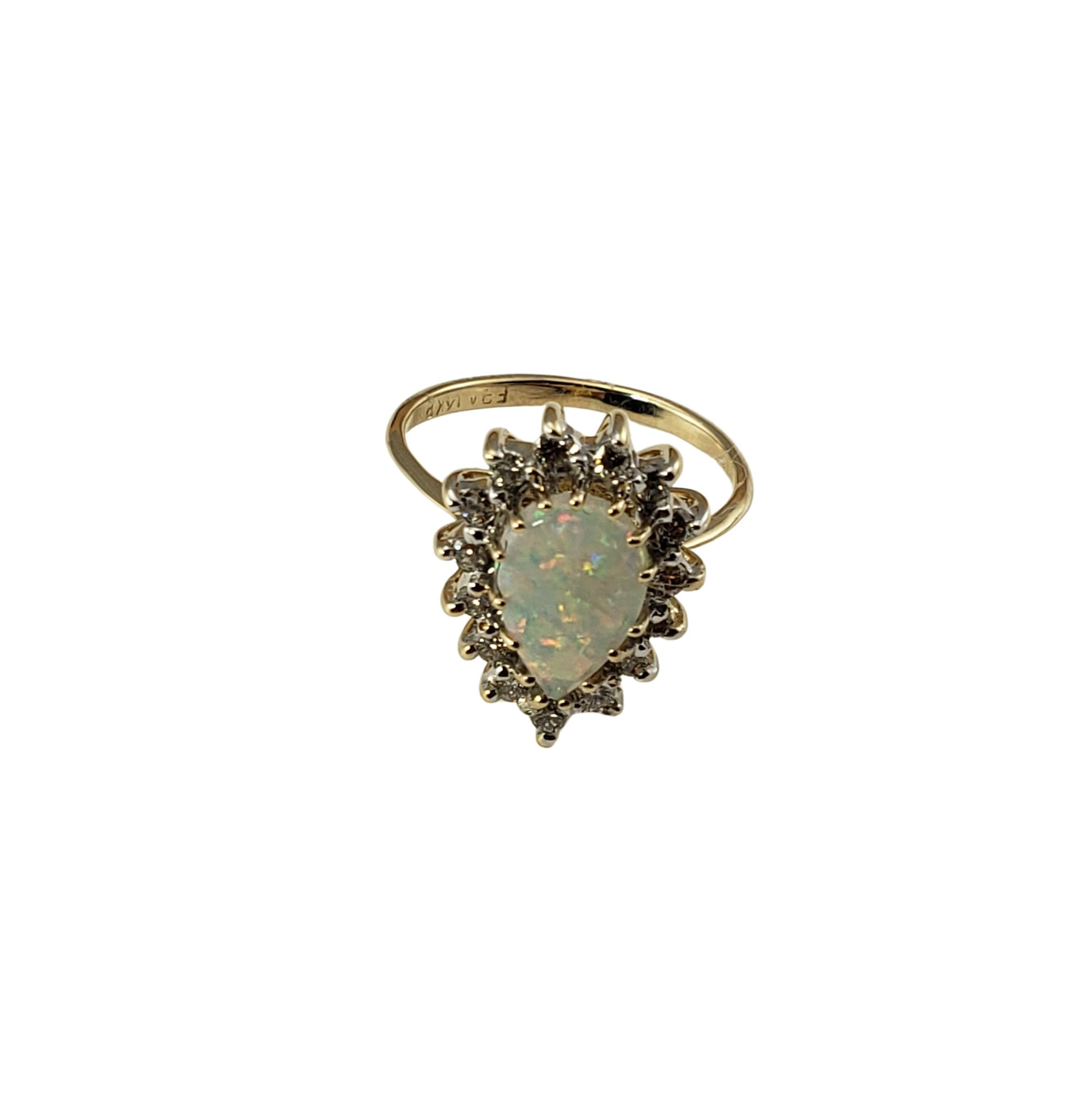 Vintage 14 Karat Yellow Gold Opal and Diamond Ring Size 4-

This stunning ring features one pear shaped opal (10 mm x 7 mm) surrounded by 15 round brilliant cut diamonds set in classic 14K yellow gold. Shank: 1.5 mm.

Approximate total diamond