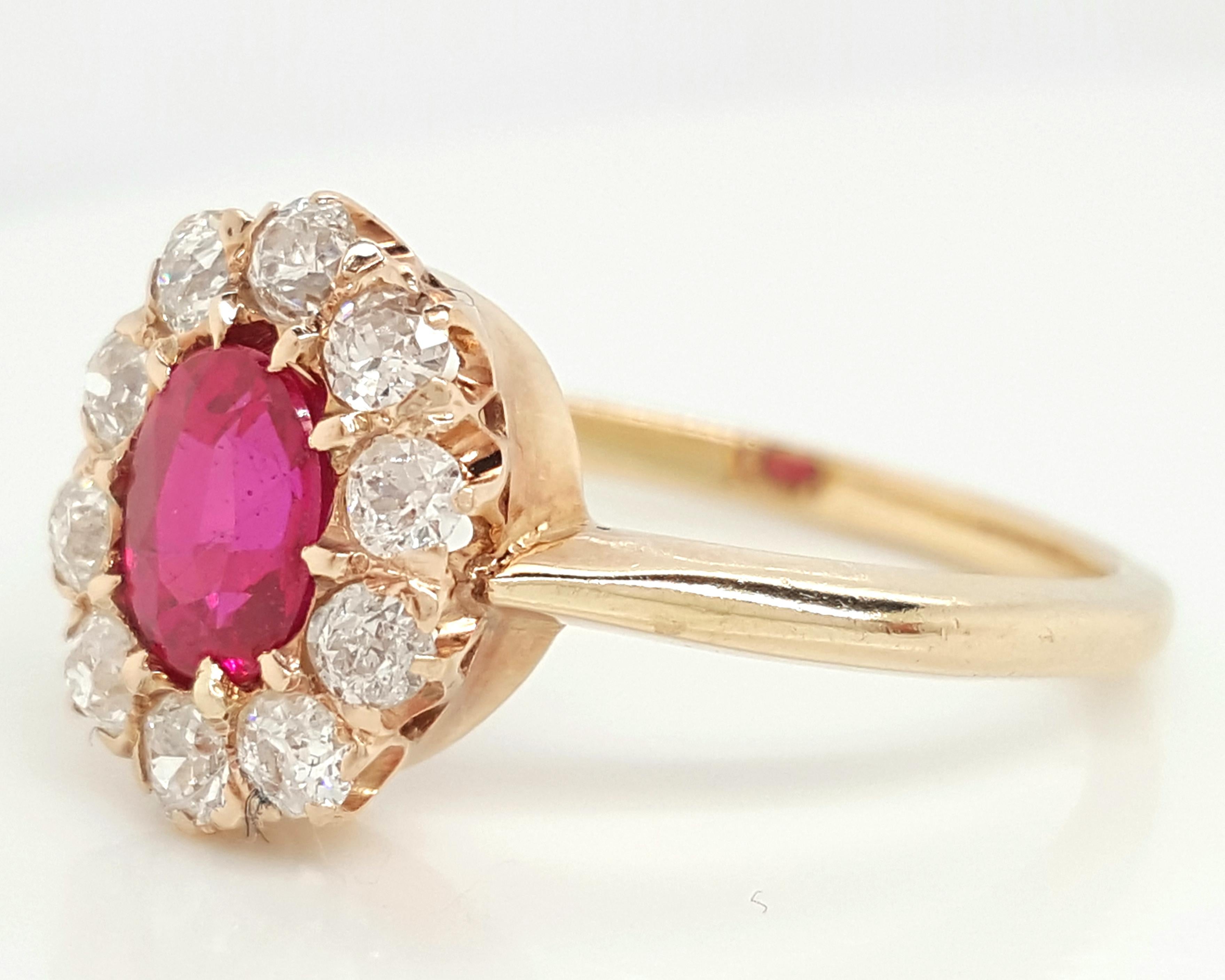 This stunning ring includes natural Oval faceted natural 1 carat red ruby center. It is surrounded by ten natural old European cut diamonds that are 0.50 carats (H-I color, I1 clarity)  total weight giving it the well-known flower halo design from