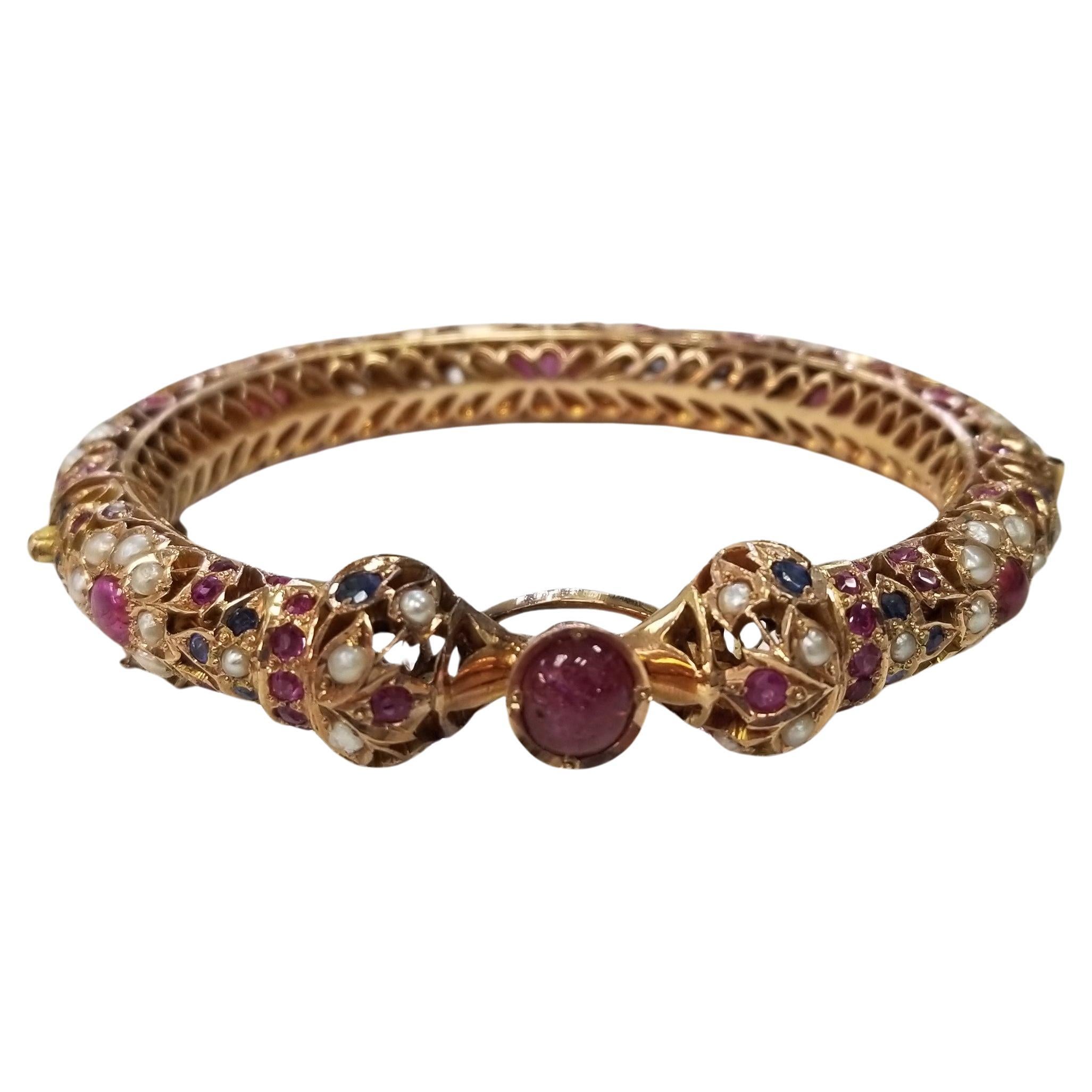 Vintage 14 Karat Yellow Gold Ruby, Sapphire and Pearl Bangle form the "India" For Sale