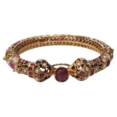 Vintage 14 Karat Yellow Gold Ruby, Sapphire and Pearl Bangle form the "India" (bracelet en rubis, saphir et perles)