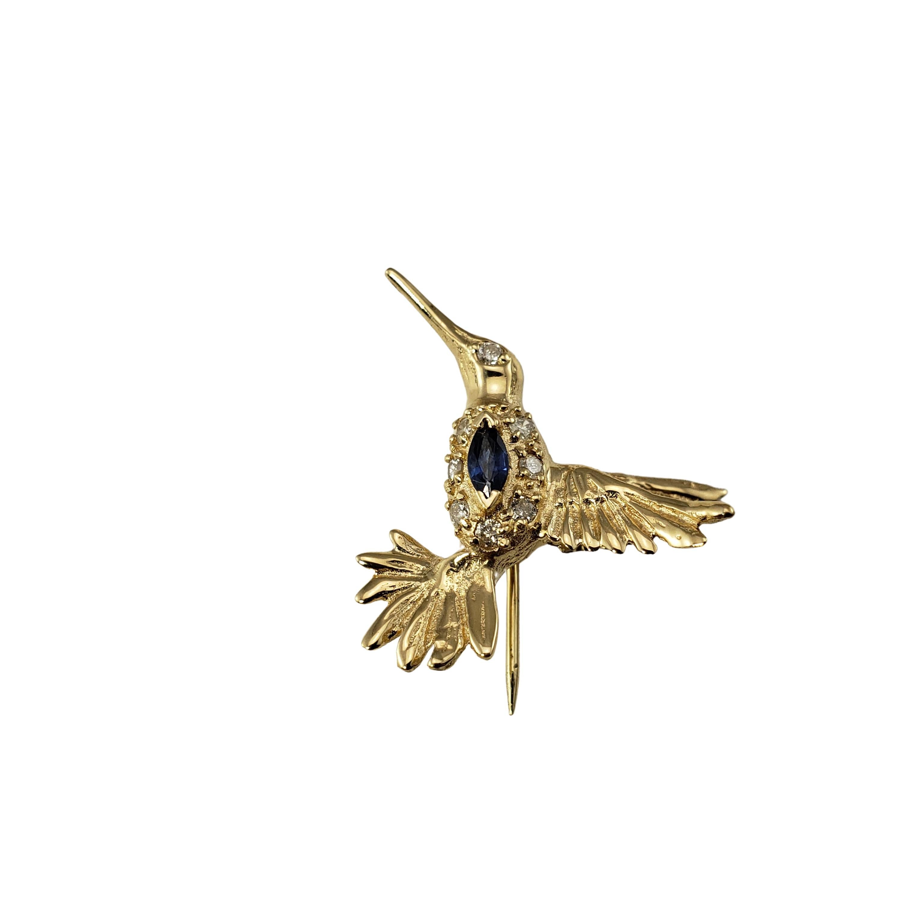 Vintage 14 Karat Yellow Gold Sapphire and Diamond Lapel Pin-

This beautifully detailed hummingbird pin features one marquis sapphire and five round brilliant cut diamonds set in 14K yellow gold.

Approximate total diamond weight:  .06 ct.

Diamond