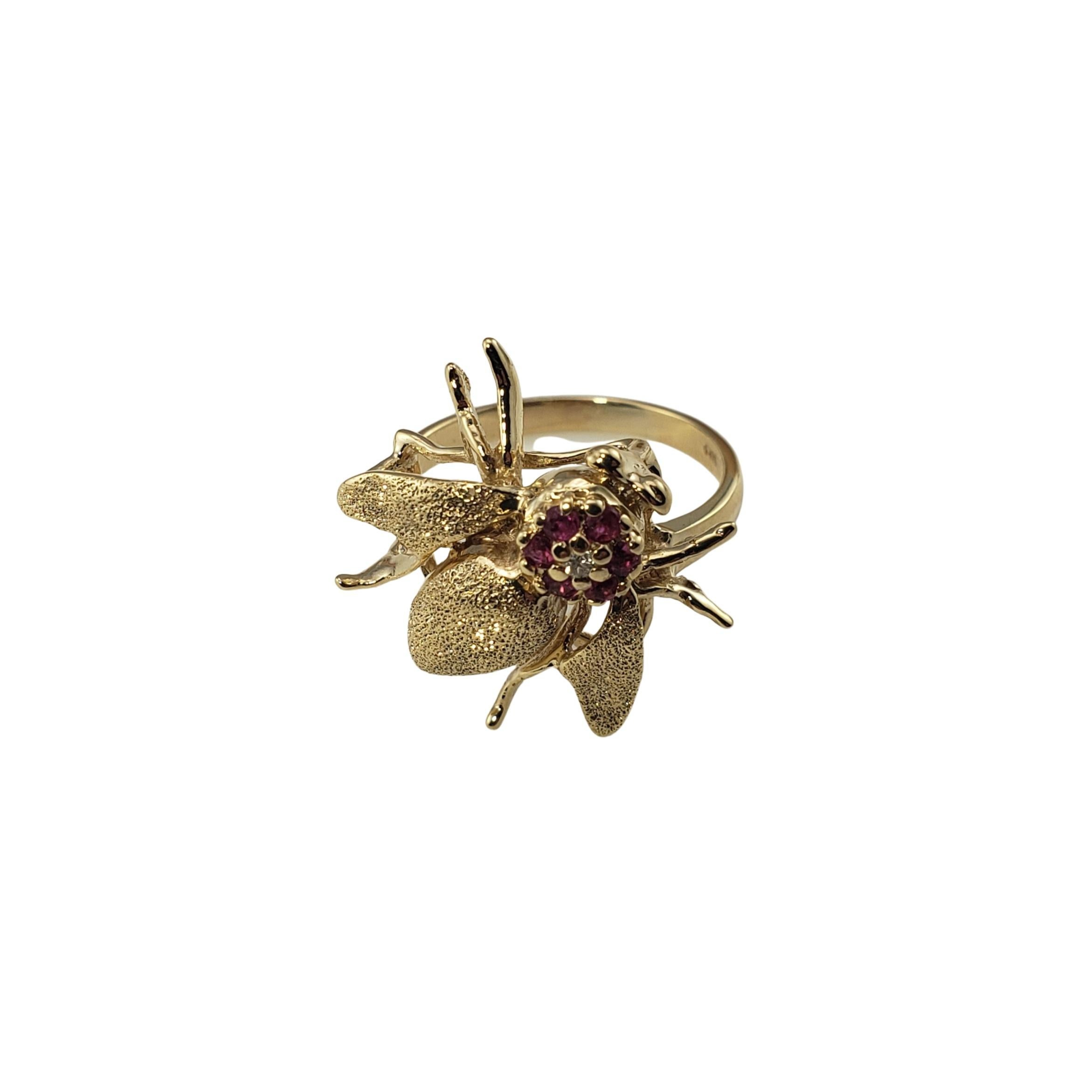 Vintage 14 Karat Yellow Gold Simulated Ruby and Diamond Bee Ring Size 7-

This lovely bee ring features one round brilliant cut diamond and six round simulated rubies set in beautifully detailed 14K yellow gold. Width: 20 mm. Shank: 2