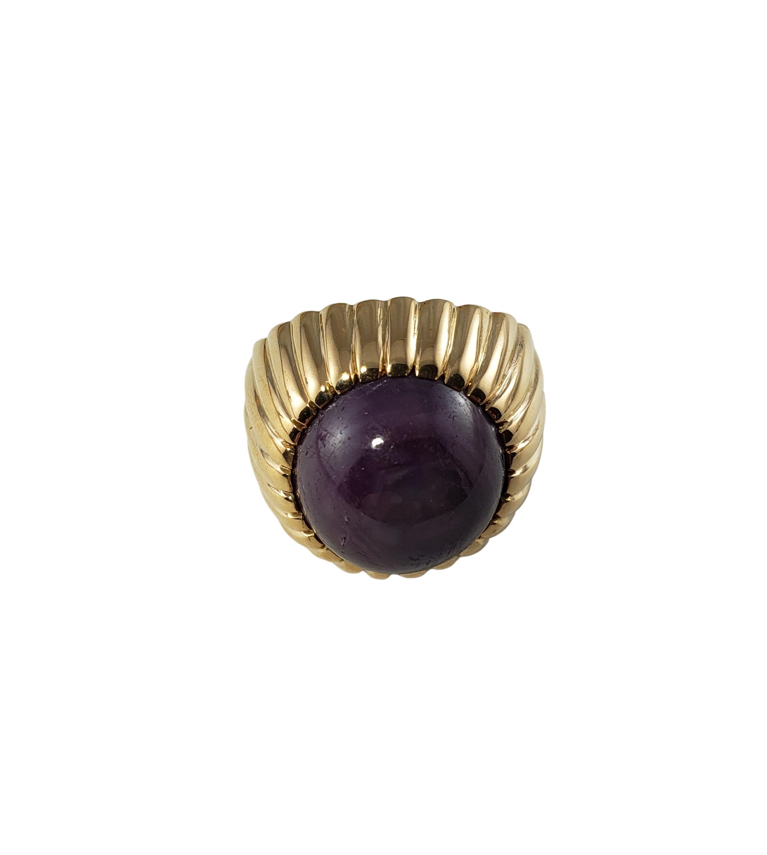 14 Karat Yellow Gold Star Ruby Ring Size 3-

This lovely ring features one round cabochon purple star ruby (12 mm) set in beautifully detailed 14K yellow gold. Width: 18 mm.
Height: 10 mm. Shank: 4 mm.

Total ruby weight: 15.50 ct.

Ring Size: