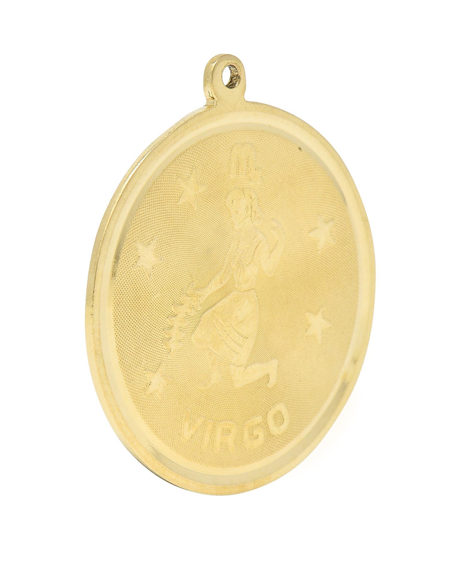 Designed as a round disk with high polished edges and a raised Virgo zodiac motif
With the astrological Virgo symbol, a woman holding wheat, stars, and inscribed 'VIRGO'
With a finely cross-hatch textured recess
Completed by pierced bale
Tested as