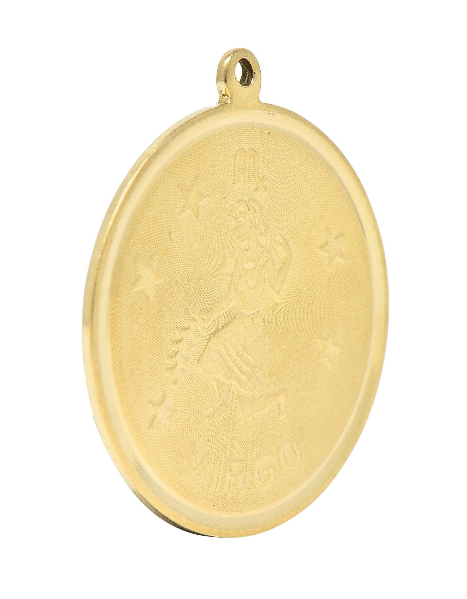 Designed as a round disk with high polished edges and a raised Virgo zodiac motif
With the astrological Virgo symbol, a woman holding wheat, stars, and inscribed 'VIRGO'
With a finely cross-hatch textured recess
Completed by pierced bale
Tested as