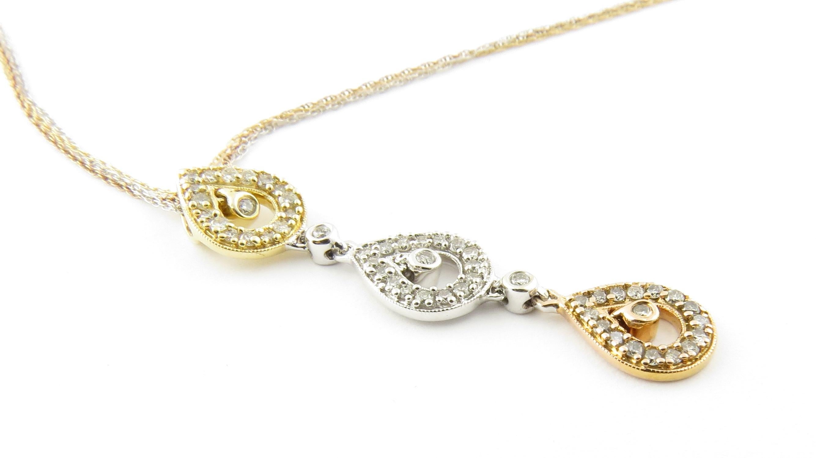 Vintage 14 Karat Yellow, Rose and White Gold Diamond Pendant Necklace.

This lovely pendant features three drops crafted in yellow, white and pink gold and detailed with 51 round brilliant cut diamonds. Suspended from a triple tricolor