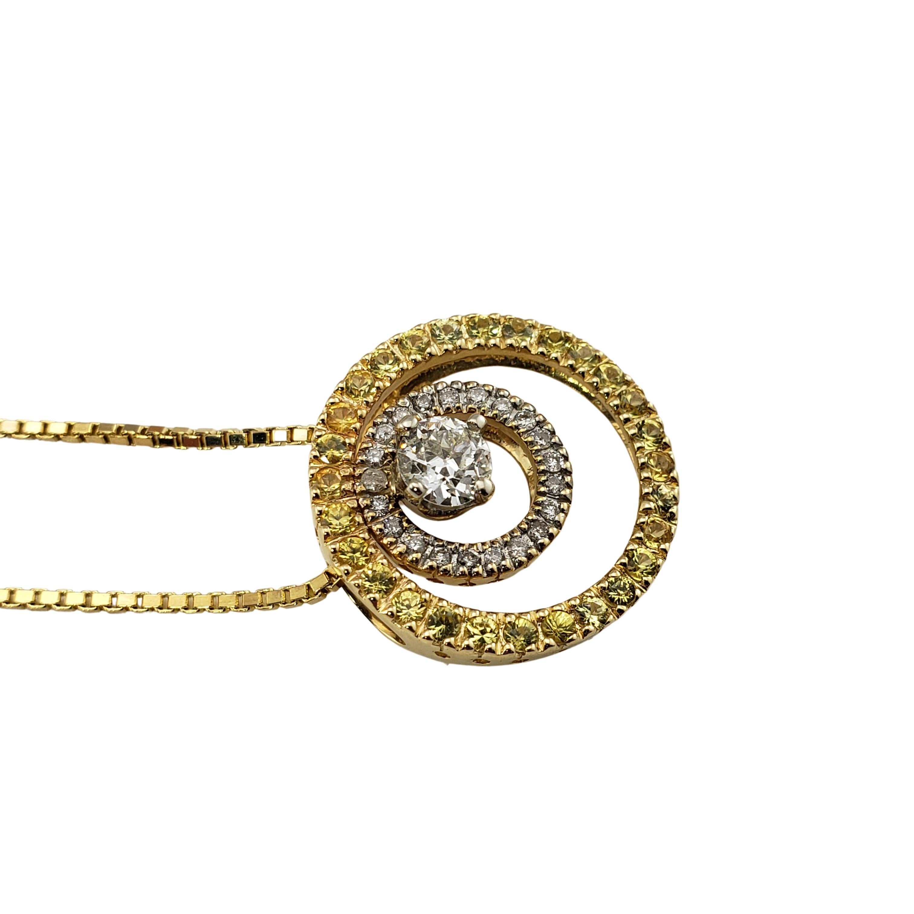 14 Karat White and Yellow Gold Diamond and Yellow Sapphire Pendant Necklace GAI Certified-

This sparkling pendant features round brilliant cut diamonds and yellow sapphires  set in beautifully detailed 14K white and yellow gold.  Suspends from a