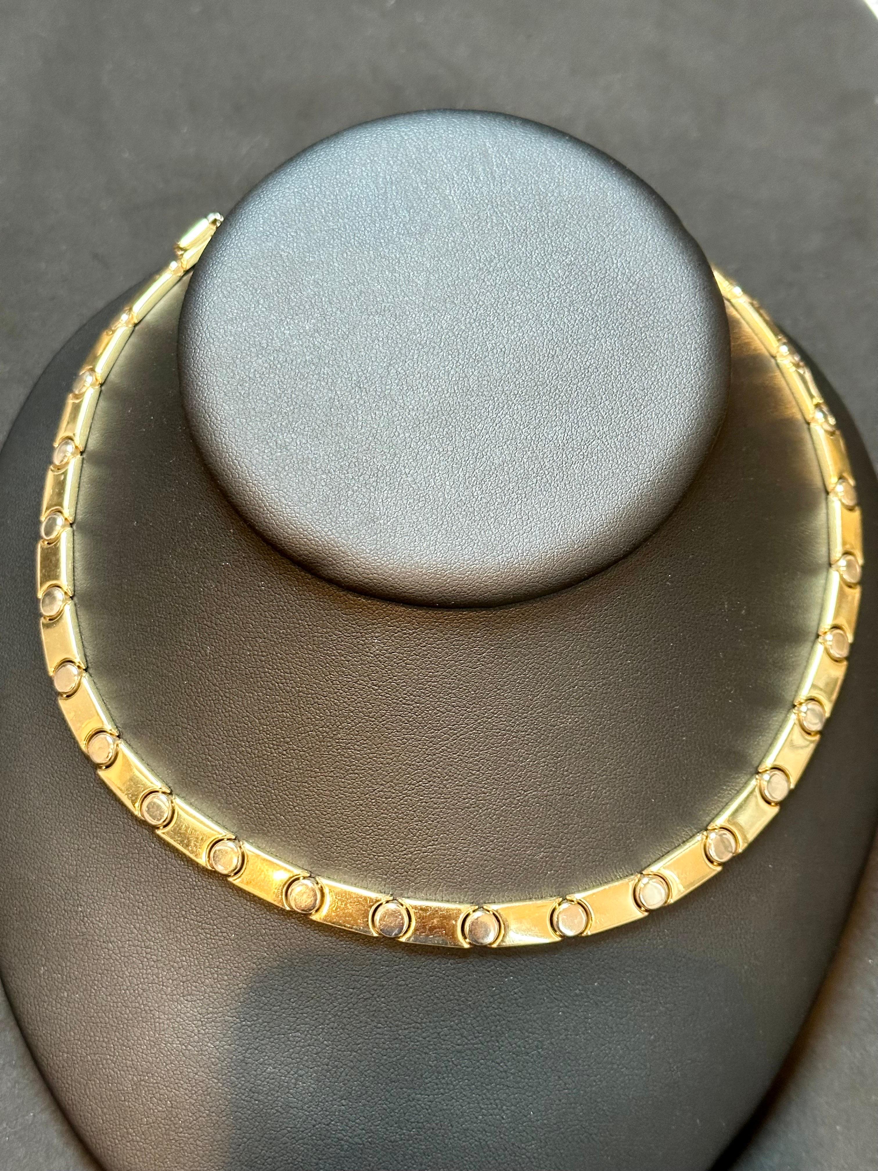 Discover the vintage charm of this 14 Kt Yellow Gold Cartier Look Reversible Screw Link Design Necklace. This necklace features a unique reversible screw link design that adds versatility and elegance to any outfit. Measuring 17 inches in length and