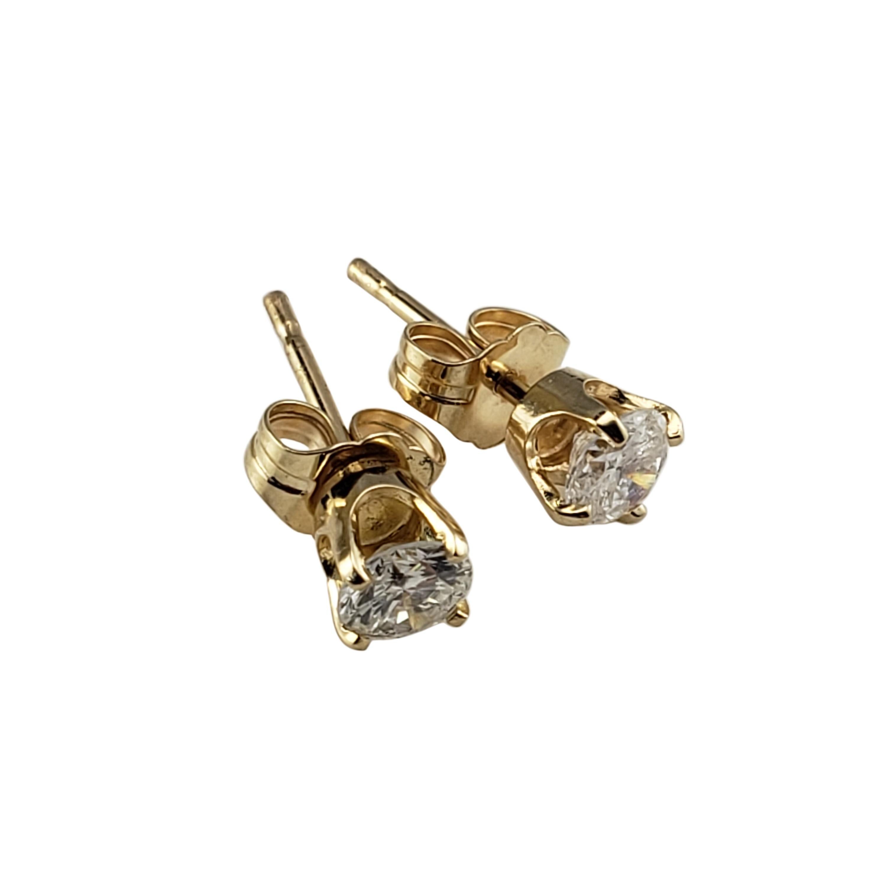 Vintage 14 Karat Yellow Gold Diamond Stud Earrings-

These sparkling stud earrings each feature one round brilliant cut diamond set in classic 14K yellow gold. Push back closures.

Approximate total diamond weight: .51 ct.

Diamond color: H

Diamond