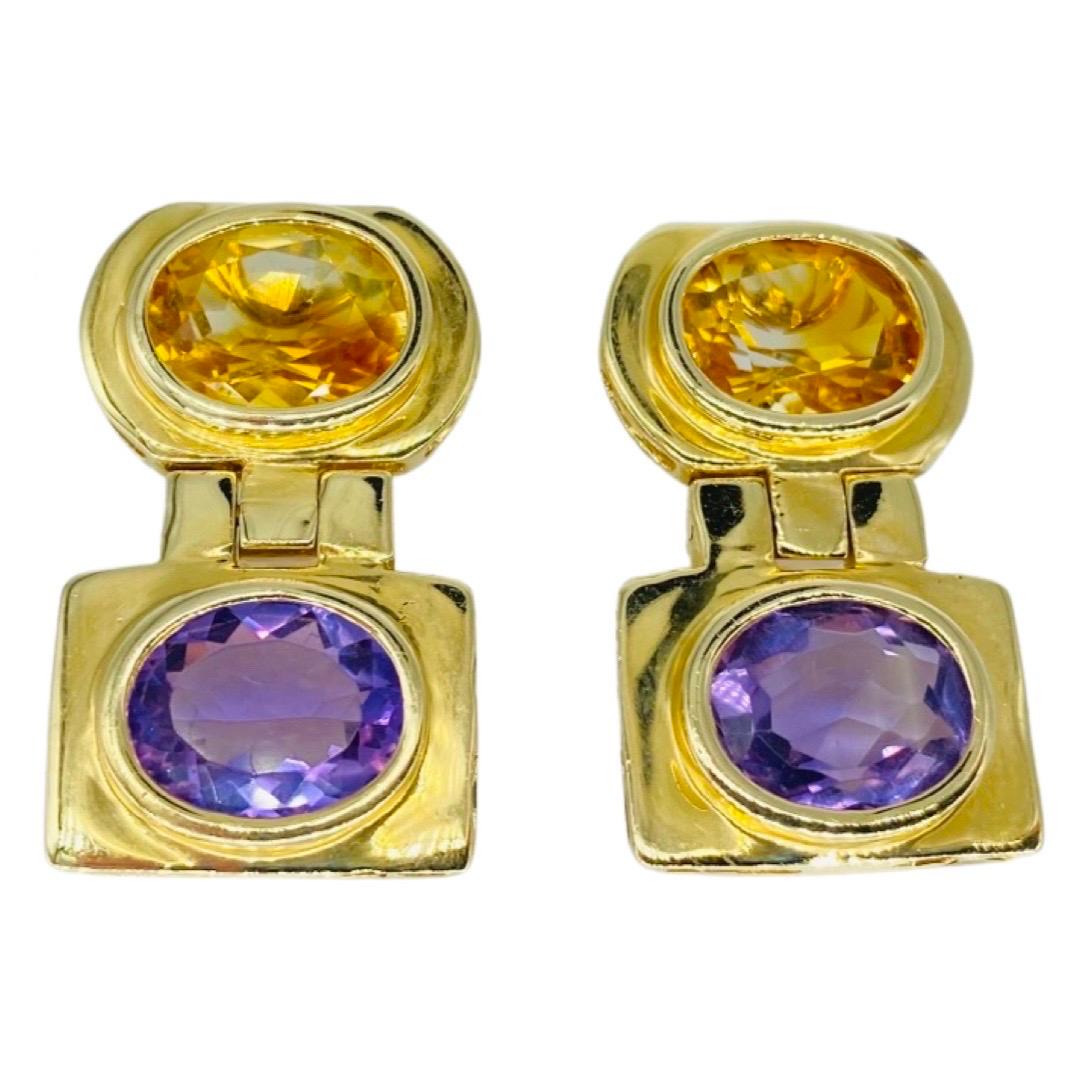 Vintage 14.00 Carat Total Weight Amethyst and Citrine Gemstones Dangling Clip Earrings 14k gold. The earrings feature 2 oval cut faceted amethyst and 2 oval cut faceted citrine gemstones very high quality work craftsmanship and details throughout