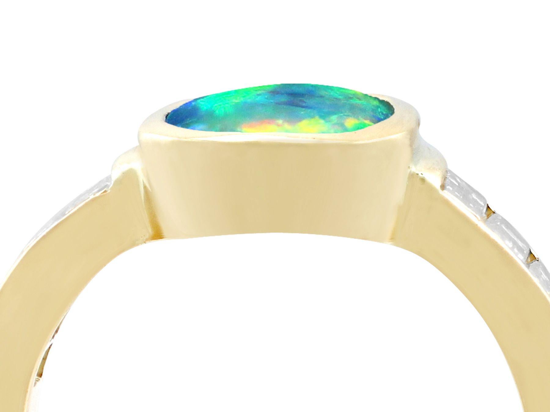 A stunning vintage French 1.40 carat opal and 1.12 carat diamond, 18 karat yellow gold dress ring; part of our diverse vintage jewelry collections.

This stunning, fine and impressive cabochon cut opal and diamond gold ring has been crafted in 18k