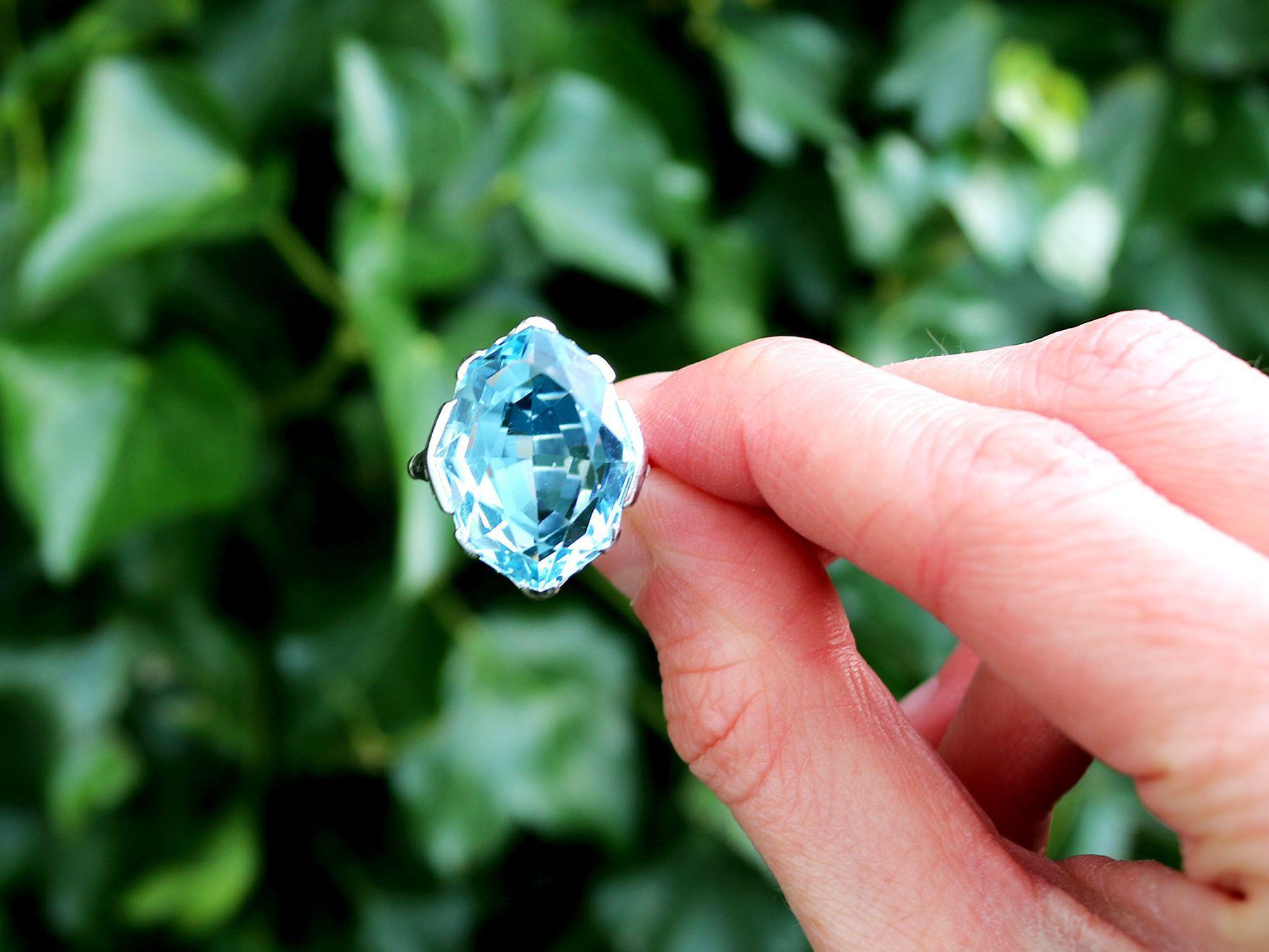 A stunning, fine and impressive 14.35 carat aquamarine and 0.20 carat diamond, 18 karat white gold ring; part of our diverse vintage jewelry and estate jewelry collections.

This stunning fine and impressive aquamarine ring has been crafted in 18k