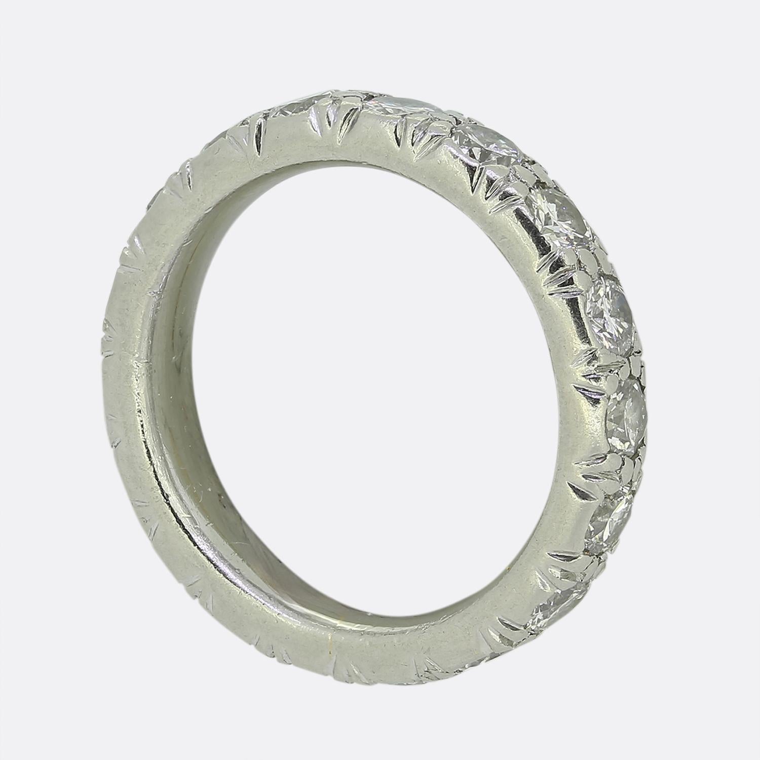 Here we have a classically styled full eternity diamond ring. This piece has been crafted from platinum and features 18 round brilliant cut diamonds which have been individually claw set in a single line formation around the outer edge. Each stone