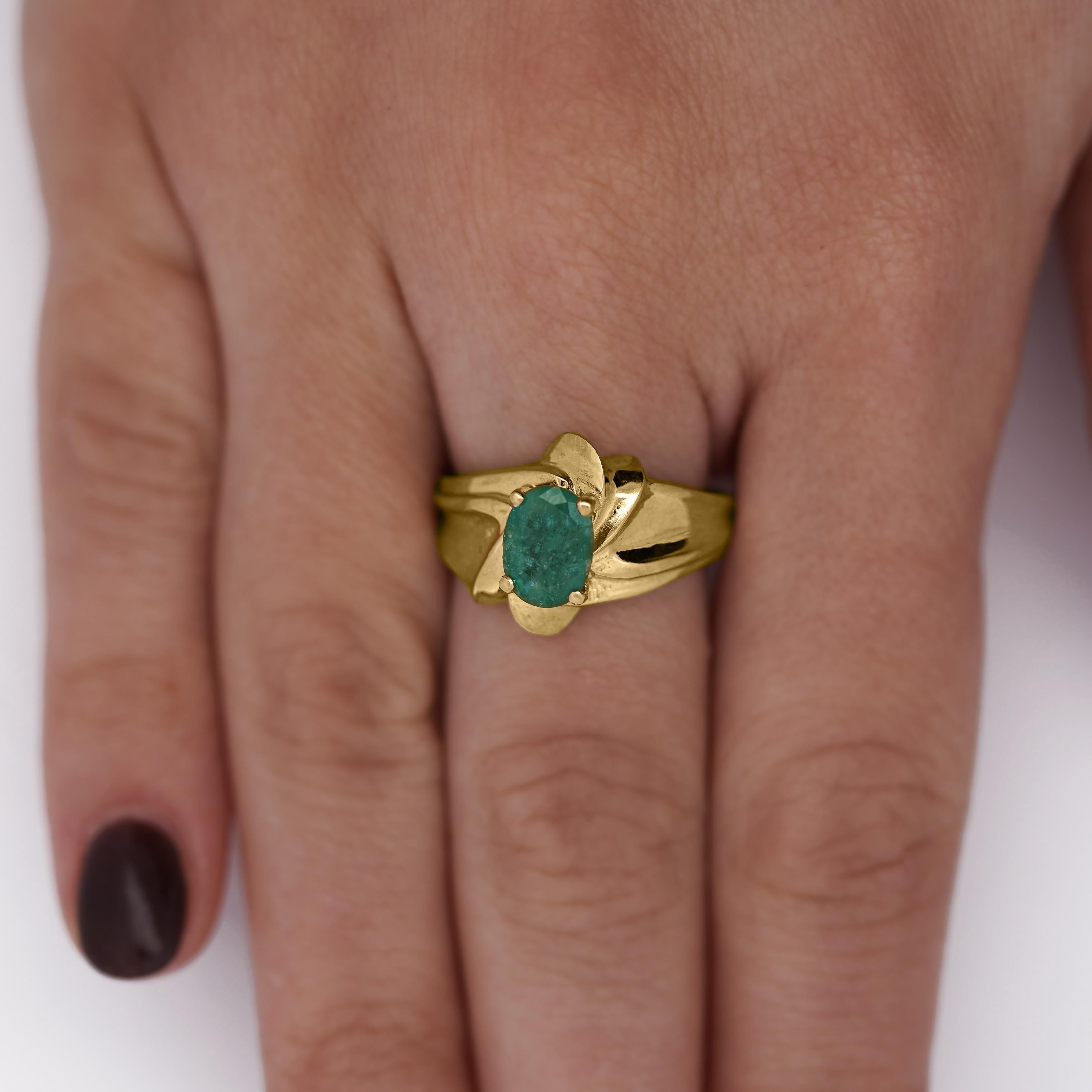 Vintage 1.44 Carat Oval Cut Natural Emerald in 14K Yellow Gold Textured Statement Ring, size 8.

Details:
Item Type: Statement Ring
Metal: 14K Yellow Gold 
Size: 8 (Adjustable)
Weight: 4.27 Grams
Face Width: 13.8mm

Center Stone Details:
Type:
