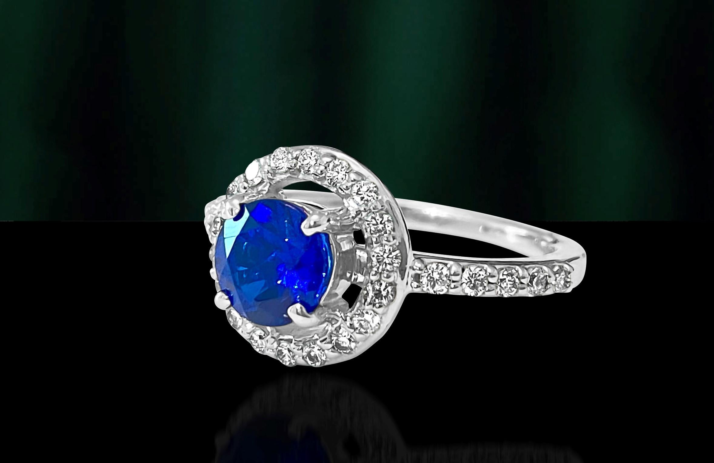 Metal: 14k white gold. 
Diamonds: 0.65 carats total. VS-SI clarity. F-G color. 100% natural earth mined round brilliant cut diamonds. 
Blue sapphire: 5.90 mm. 0.80 carat. Round cut. Sync blue sapphire set in prongs. 
 Total weight of the ring: 3.44