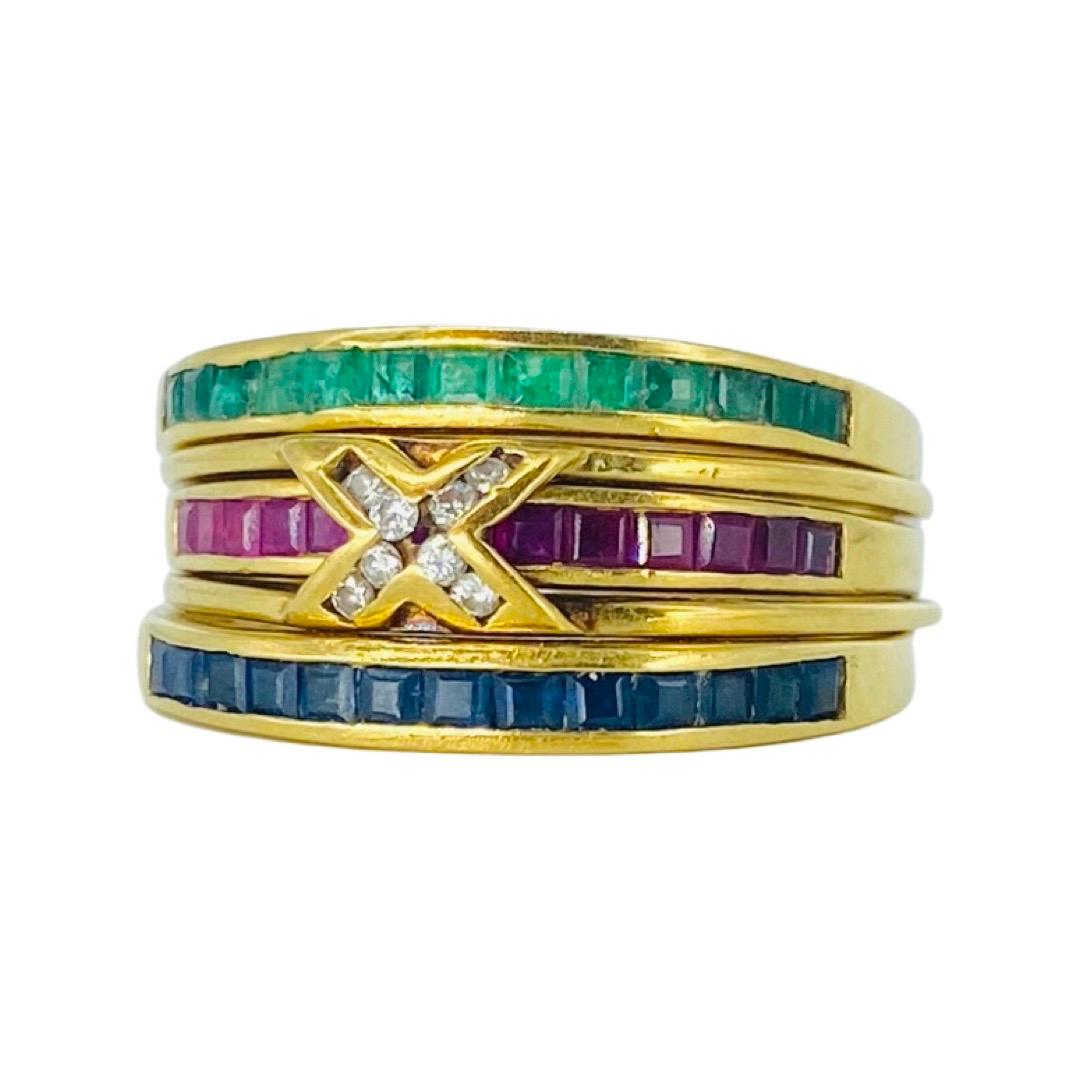 Multi-Gemstone Vintage 1.45 Carat Emeralds, Sapphires, Rubys and Diamonds Stackable Rings 18k. There are 4 rings in total with a switchable X center diamonds that you can switch the gemstones rings to feature the diamonds when desired. The total