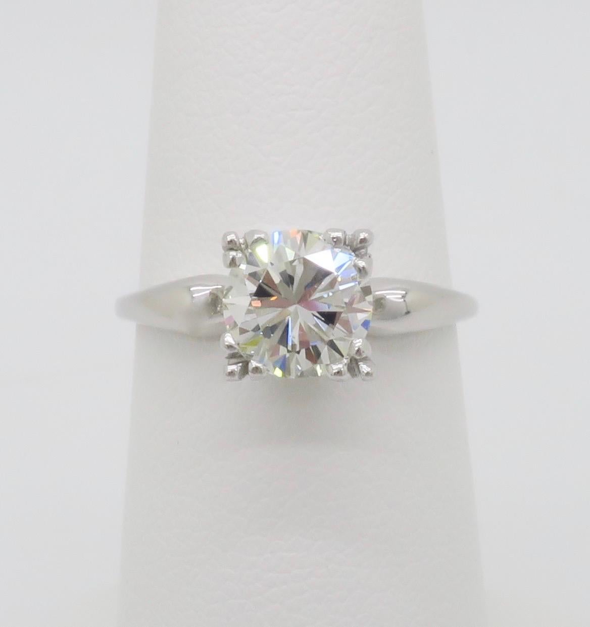 Vintage diamond solitaire ring featuring a beautiful 1.45ct Earth Mined Round Brilliant cut diamond. 

Center Diamond Carat Weight: 1.45CT 
Center Diamond Cut: Round Brilliant Cut  
Center Diamond Color: I
Center Diamond Clarity: VS2
Metal: 14k