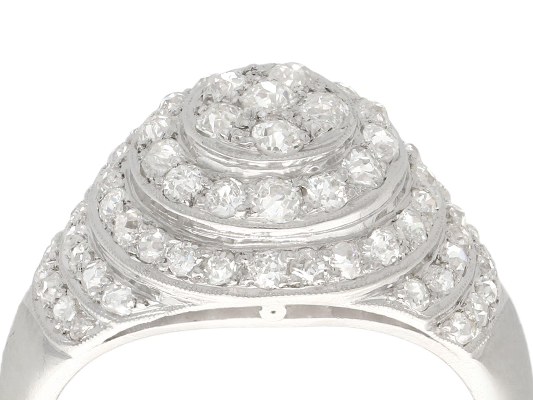 A stunning, fine and impressive vintage 1.48 carat diamond and platinum bombé style cocktail ring; part of our diverse diamond jewelry and estate jewelry collections.

This stunning, fine and impressive vintage diamond ring has been crafted in