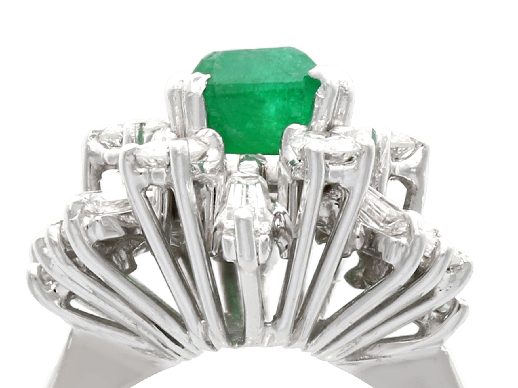 A fine and impressive vintage 1.48 carat natural emerald and 1.08 carat diamond, 18 karat white gold cocktail ring; part of our vintage jewelry and estate jewelry collections

This impressive vintage 1970s cluster ring has been crafted in 18k white
