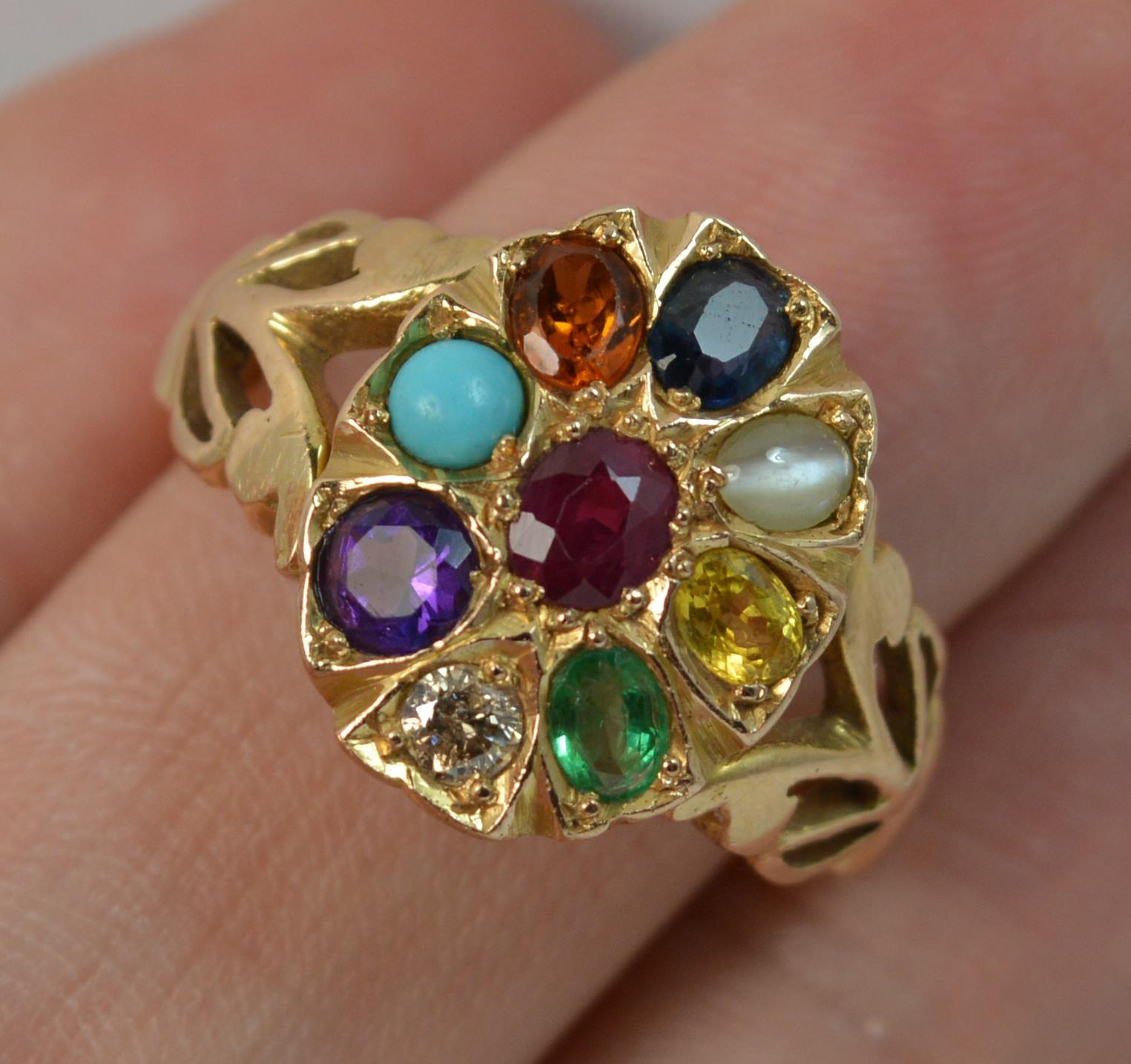 A superb vintage solid 14ct gold and gemstone set Navaratna cluster ring.
SIZE ; R UK, 8 3/4 US
Split pierced shoulders build up to a large oval cluster head, 12.5mm x 15.5mm approx.

This is a rare and unusual Navaratna design which has gemstones