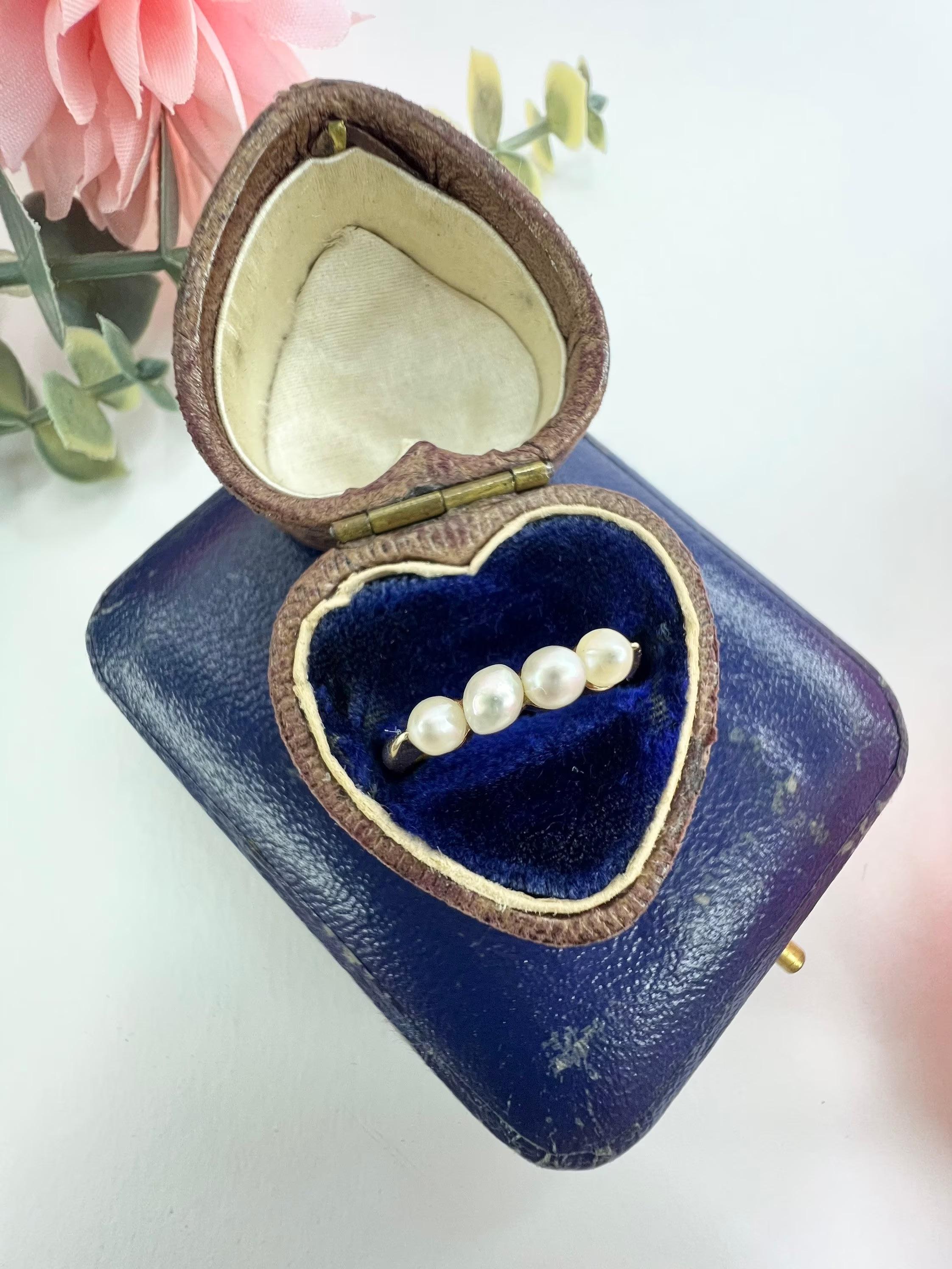 Vintage Pearl Ring 

14ct Gold Stamped 

Circa 1980’s

Pretty Little Vintage Ring, Set with Four Beautiful Cultured Pearls. 

Width Measures Approx 11mm & Height Approx 3mm

UK Size J

US Size 5

Can be resized using our resizing service,
please
