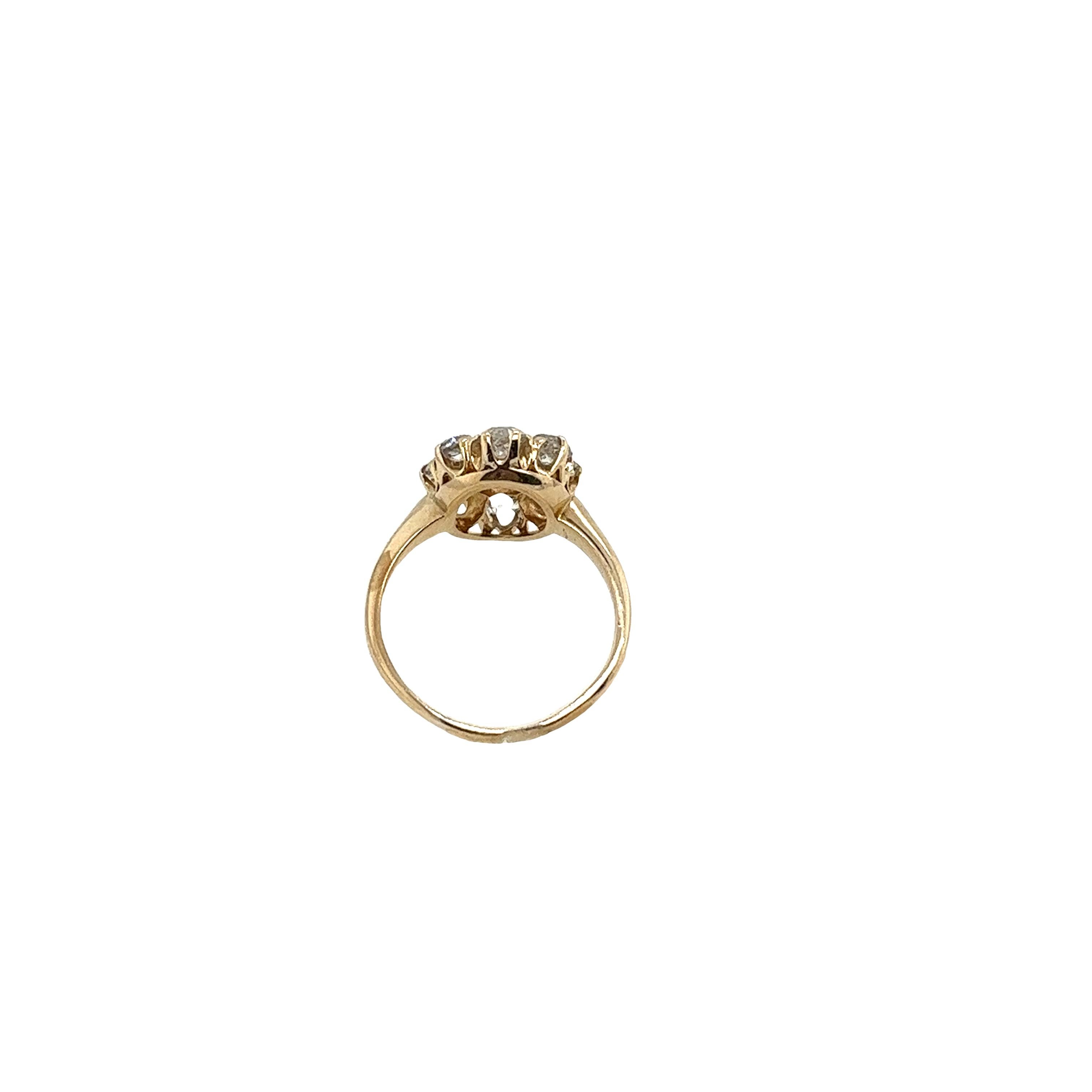 An elegant and unique vintage diamond cluster ring, set with 0.95ct old cut diamonds, K colour and SI3 clarity in a 14ct yellow gold setting. 
Total Diamond Weight: 0.95ct
Diamond Colour: K
Width of Head: 13.60mm
Length of Head: 11.90mm
Width of