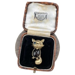 Vintage 14ct Yellow Gold, 1970s Cat Brooch with Cabochon Garnet and Sapphire Vintage 14ct Yellow Gold, 1970s Cat Brooch with Cabochon Garnet and Sapphire