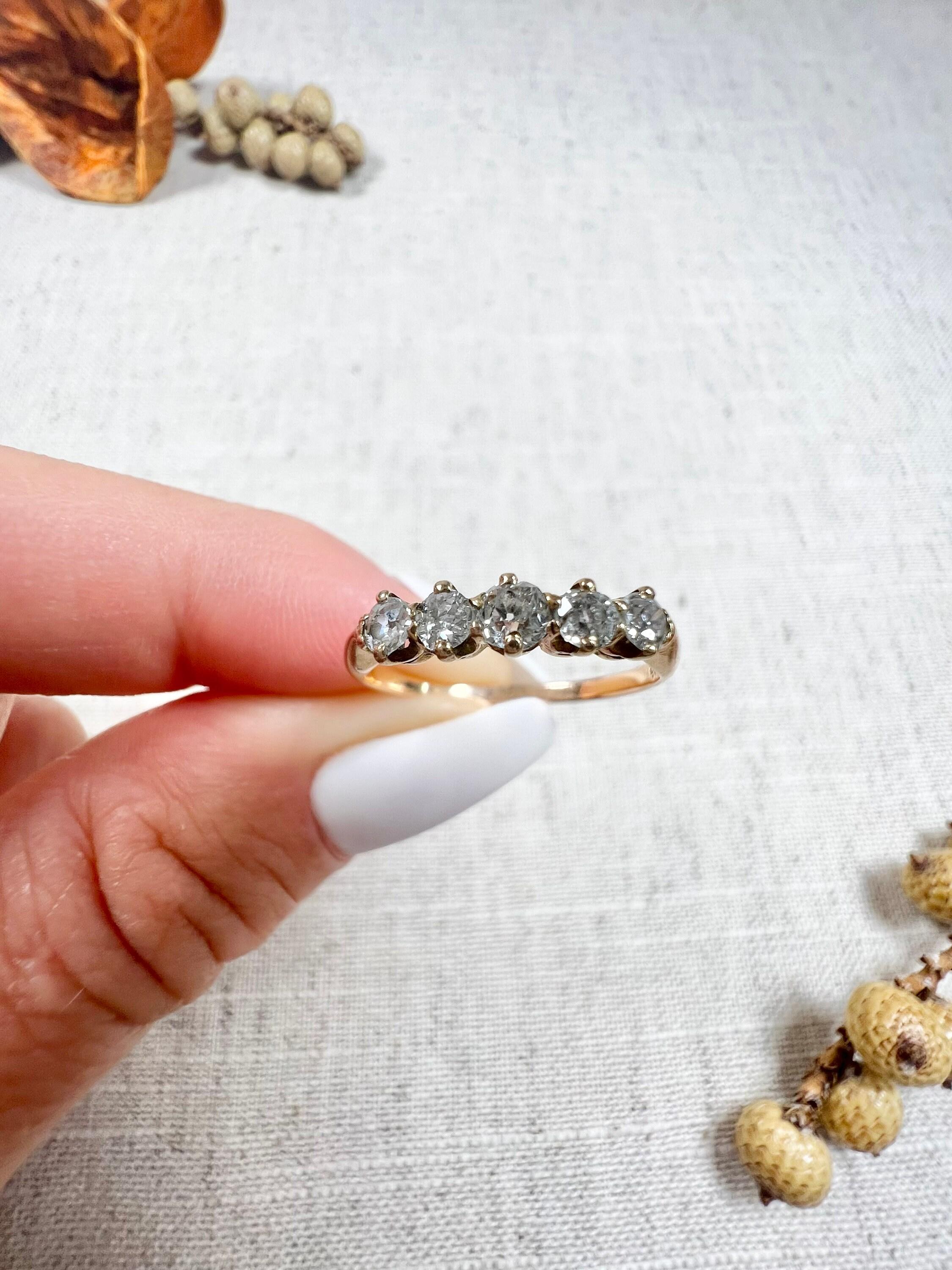 Vintage Diamond Ring

14ct Yellow Gold Stamped 585

Circa 1940s 

This beautiful ring will add a touch of elegance to any outfit. The ring is set with five dazzling diamonds, which gives it a timeless appeal. The total diamond weight is